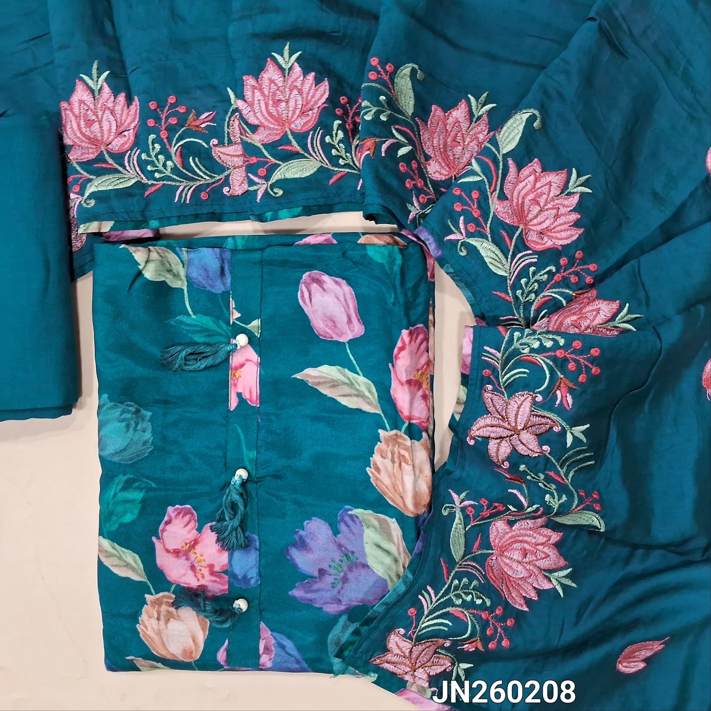 Designer dark teal blue pure soft malai silk unstitched salwar material,tasseles work on yoke( shiny,lining needed) floral printed all over,matching santoon bottom, rich embroidery work on soft silk cotton dupatta. JN260208