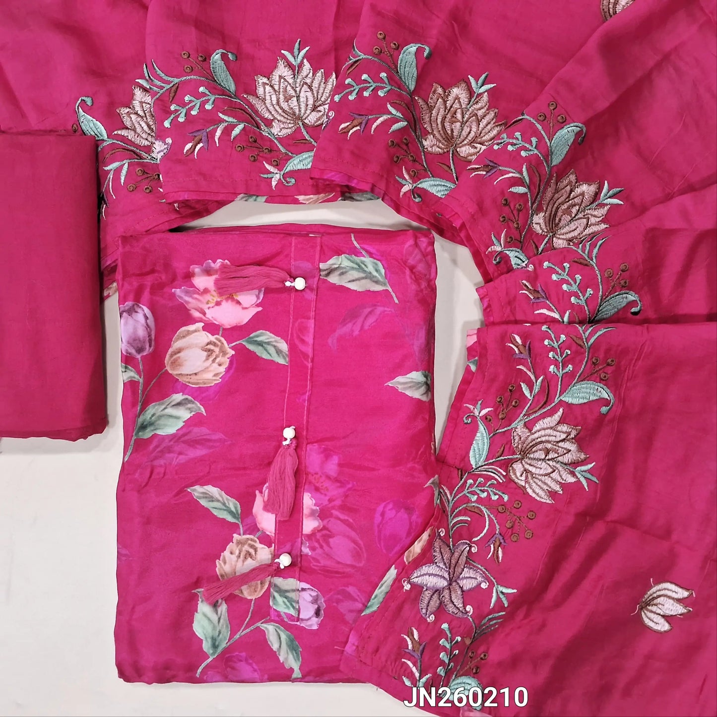 Designer bright pink pure soft malai silk unstitched salwar material,tasseles work on yoke( shiny,lining needed) floral printed all over,matching santoon bottom, rich embroidery work on soft silk cotton dupatta. JN260210