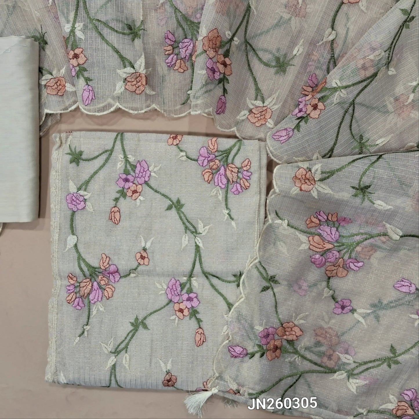 Designer light beige premium tissue kota unstitched salwar material (lining needed) rich embroidery & panel design on front,gold zari checked all over, silk cotton bottom, rich thread embroidery work on tissue kota dupatta with tassels. JN260305