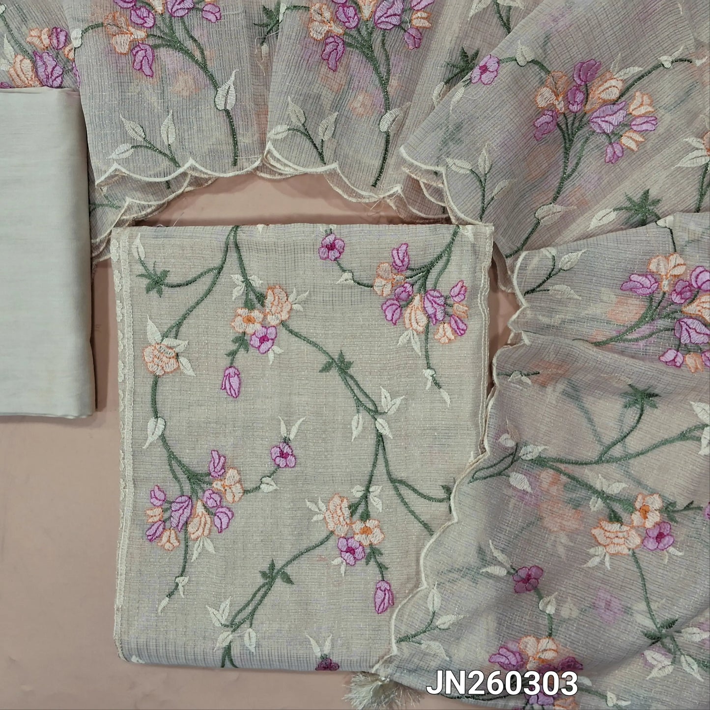Designer light beige premium tissue kota unstitched salwar material (lining needed) rich embroidery & panel design on front,gold zari checked all over, silk cotton bottom, rich thread embroidery work on tissue kota dupatta with tassels. JN260303