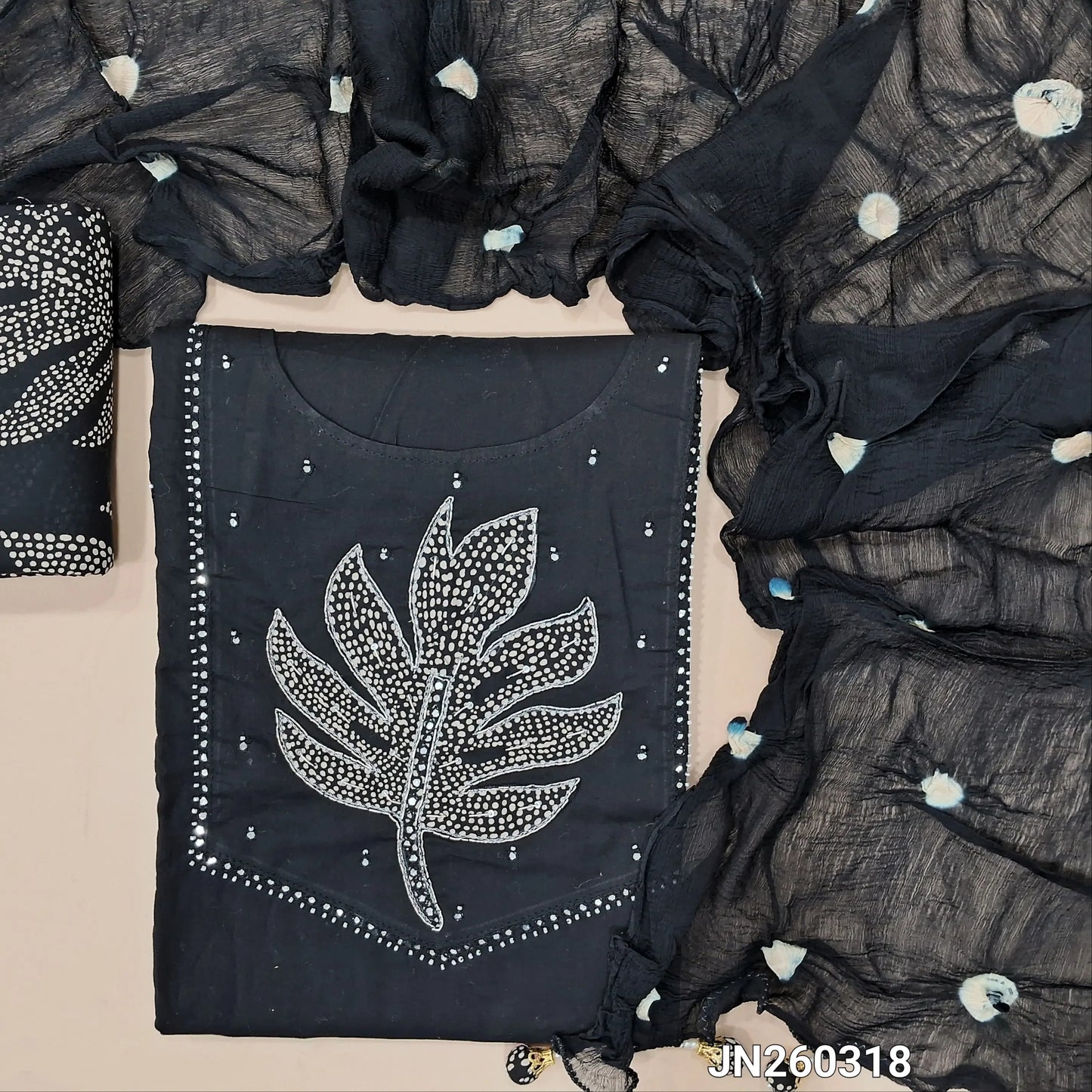 Designer black premium soft cotton unstitched salwar material (lining needed) applique patch work with zardozi,bead & faux mirror work on yoke, printed cotton bottom, dye and dyed pure chiffon short width dupatta. JN260318