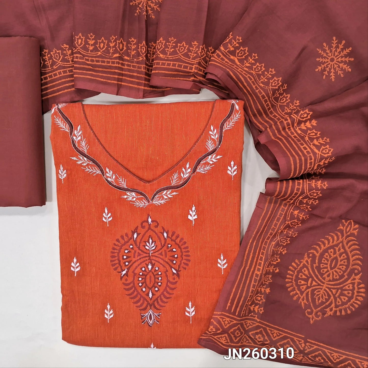 Rust orange premium soft handloom cotton unstitched salwar material (lining optional)thread embroidery &block print work on yoke, vertical design all over,maroon cotton bottom,hand block printed with mul cotton dupatta. JN260310