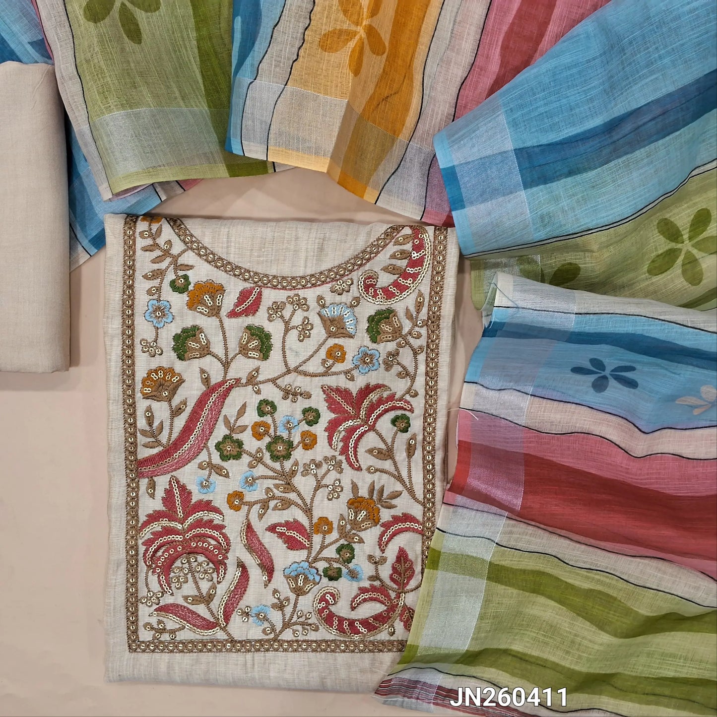 Designer light beige soft silk cotton unstitched salwar material,(light weight,lining needed)(PINK) rich embroidery & sequins work on yoke,matching spun cotton bottom, multicolour semi linen dupatta with gold tissue borders. JN260411