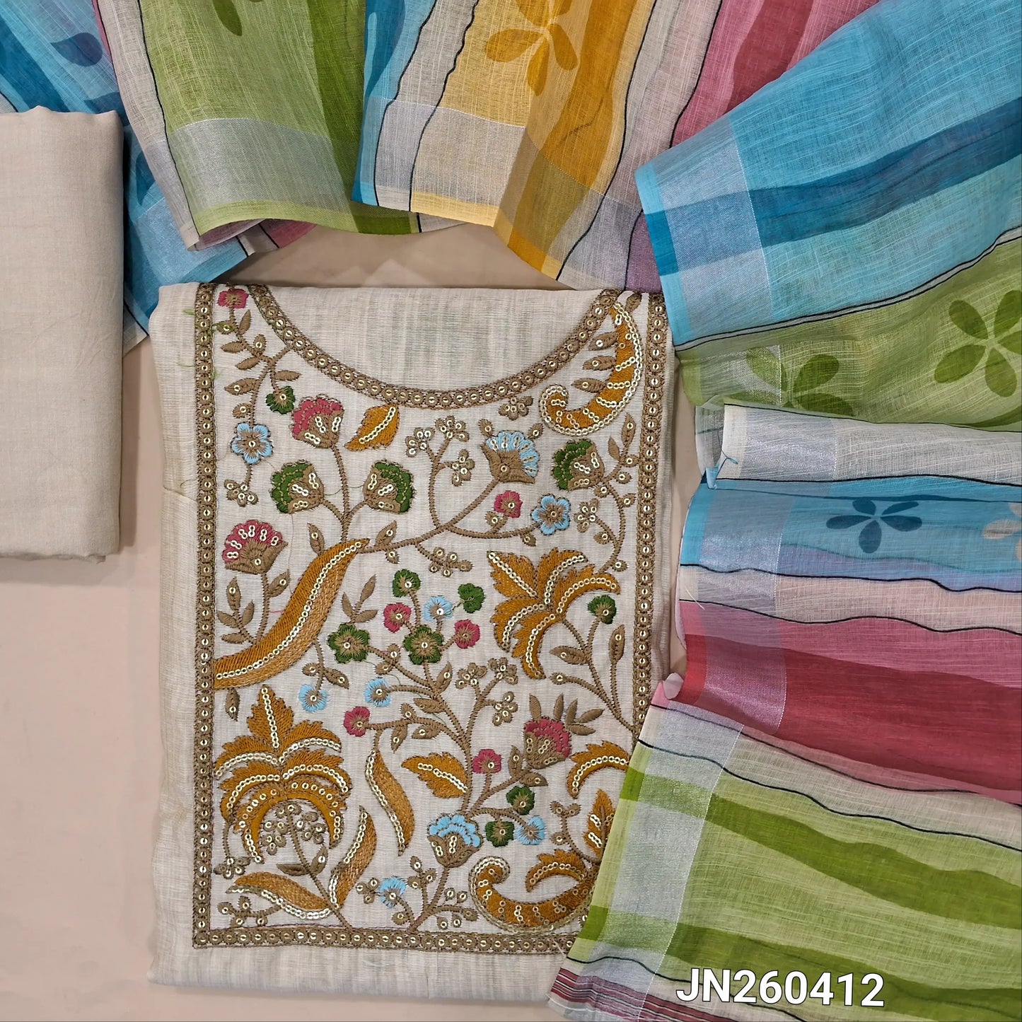 Designer light beige soft silk cotton unstitched salwar material,(light weight,lining needed)(YELLOW) rich embroidery & sequins work on yoke,matching spun cotton bottom, multicolour semi linen dupatta with gold tissue borders. JN260412