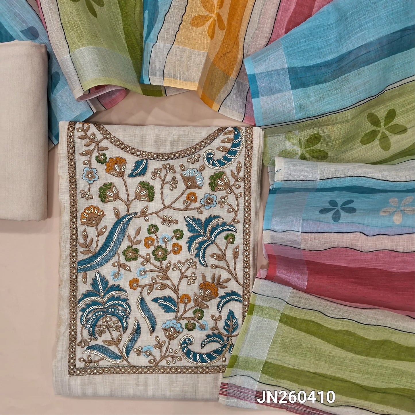 Designer light beige soft silk cotton unstitched salwar material,(light weight,lining needed)(BLUE) rich embroidery & sequins work on yoke,matching spun cotton bottom, multicolour semi linen dupatta with gold tissue borders. JN260410