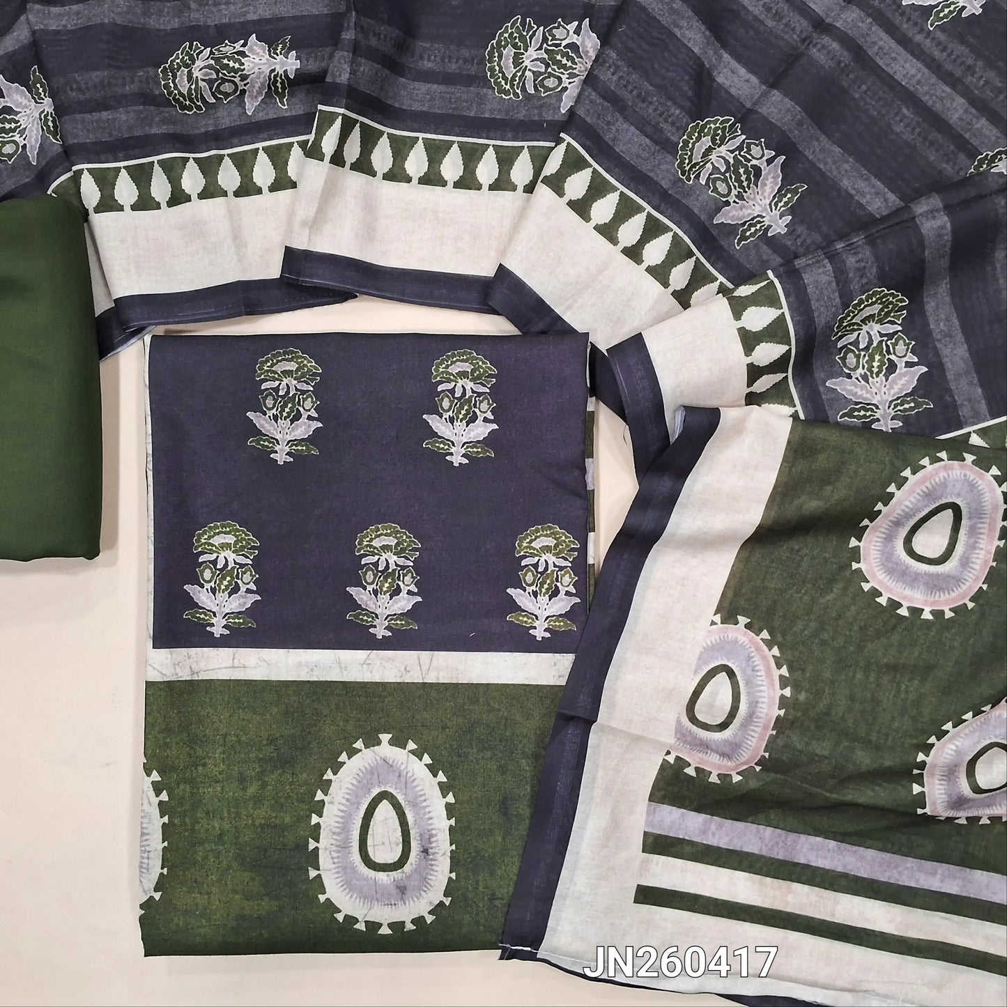 Dark grey digital printed silk cotton unstitched salwar material(lining optional)panel design on front,ajrak prints all over, green cotton bottom, digital printed soft silk cotton dupatta. JN260417