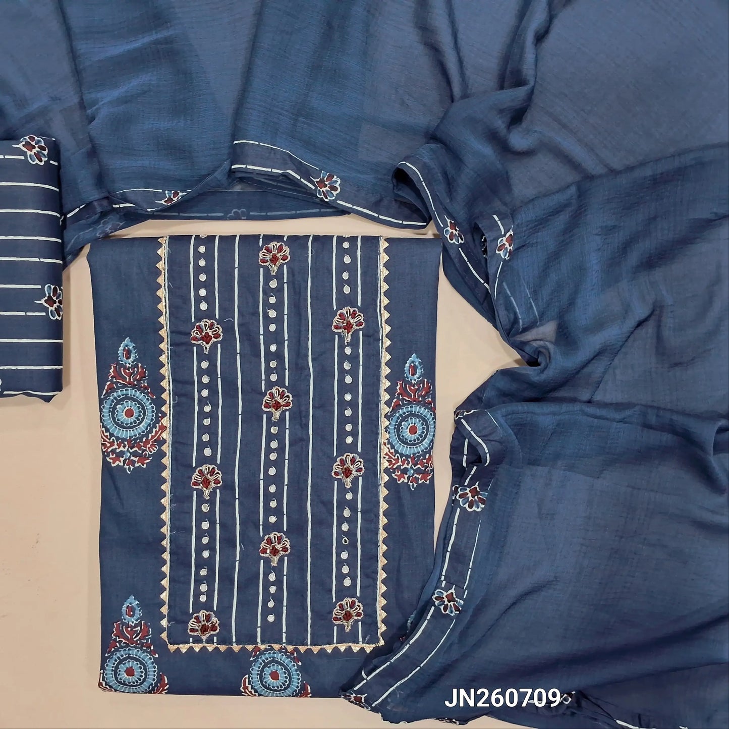Dark blue pure cotton unstitched salwar material, bead,sequins work on yoke, floral printed all over,(lining optional) printed cotton bottom, plain chiffon dupatta. JN260709