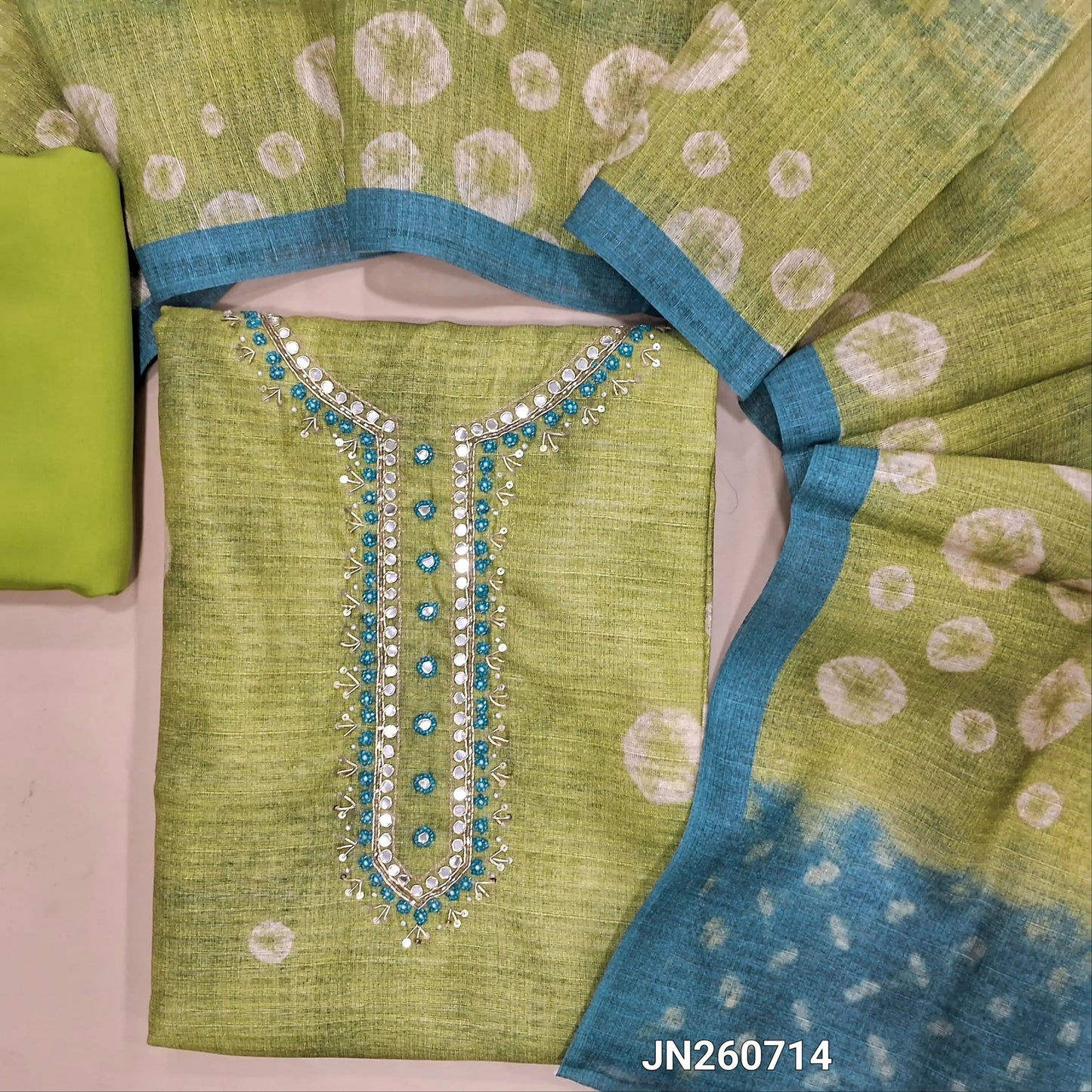 Pastel green jute silk unstitched salwar material ( lining needed) bandhini print allover, zardozi,cut,sugar bead work on yoke,matching silky bottom, digital printed jute silk dupatta. JN260714