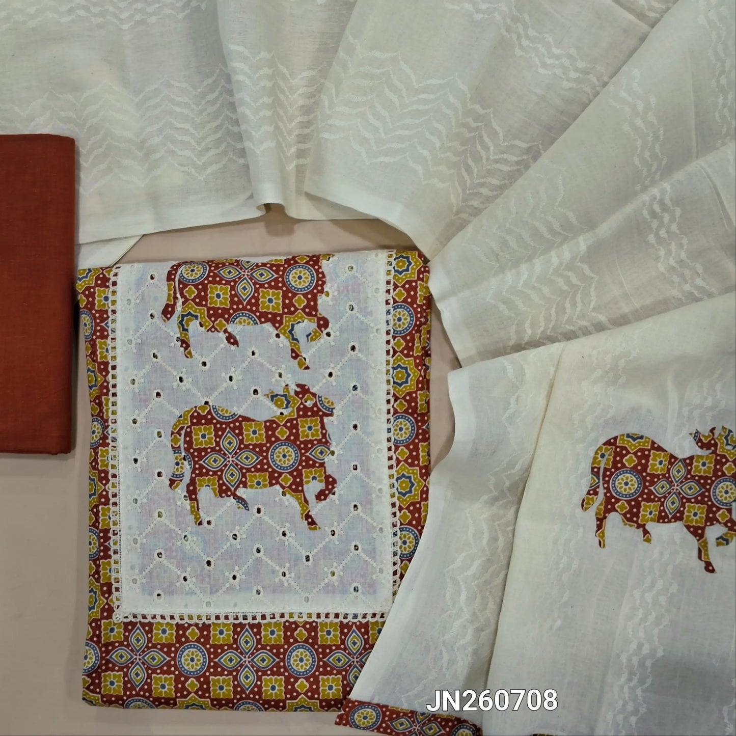 Birck red ajrak printed soft cotton unstitched salwar material,applique & pichwai design on yoke(soft ,lining needed)matching provided bottom, applique patch work on pure cotton dupatta. JN260708