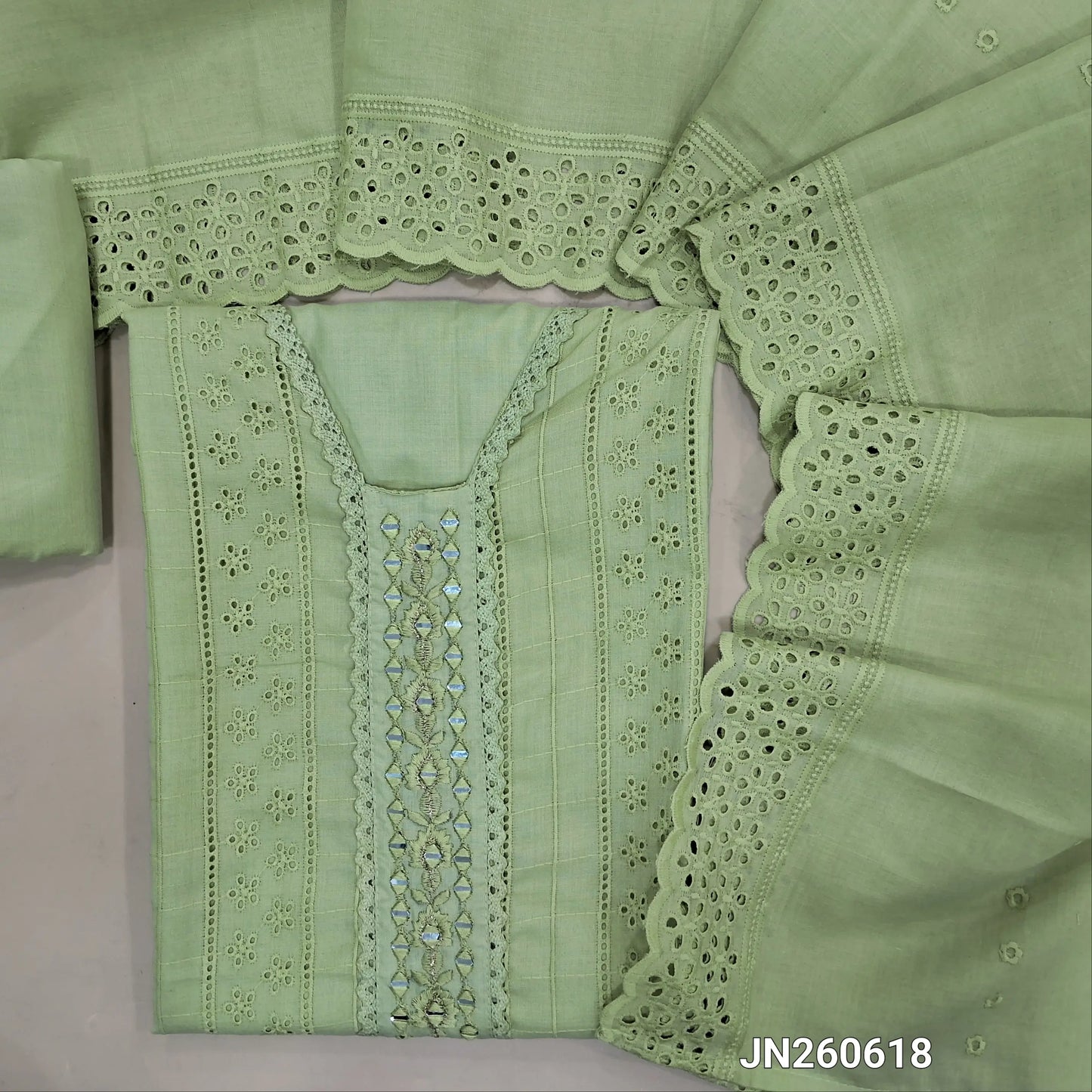 Pastel green schiffli embroidered soft glazed cotton unstitched salwar material(lining needed) lace detailing & real mirror work on yoke,embroidery allover, cotton bottom, schiffli embroidered & cut work, mul cotton dupatta with scallop borders.JN260618