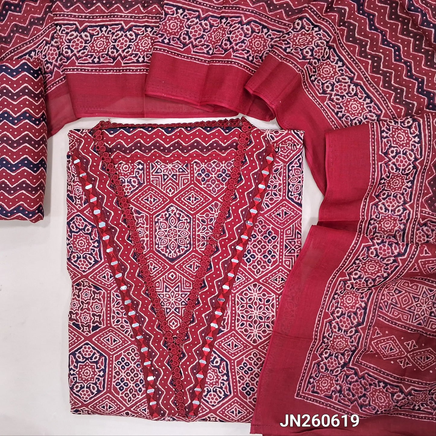 Reddish maroon ajrak hand block printed pure cotton unstitched salwar material,collared neck with real mirror(lining optional)printed cotton bottom,printed full length mul cotton dupatta.JN260619