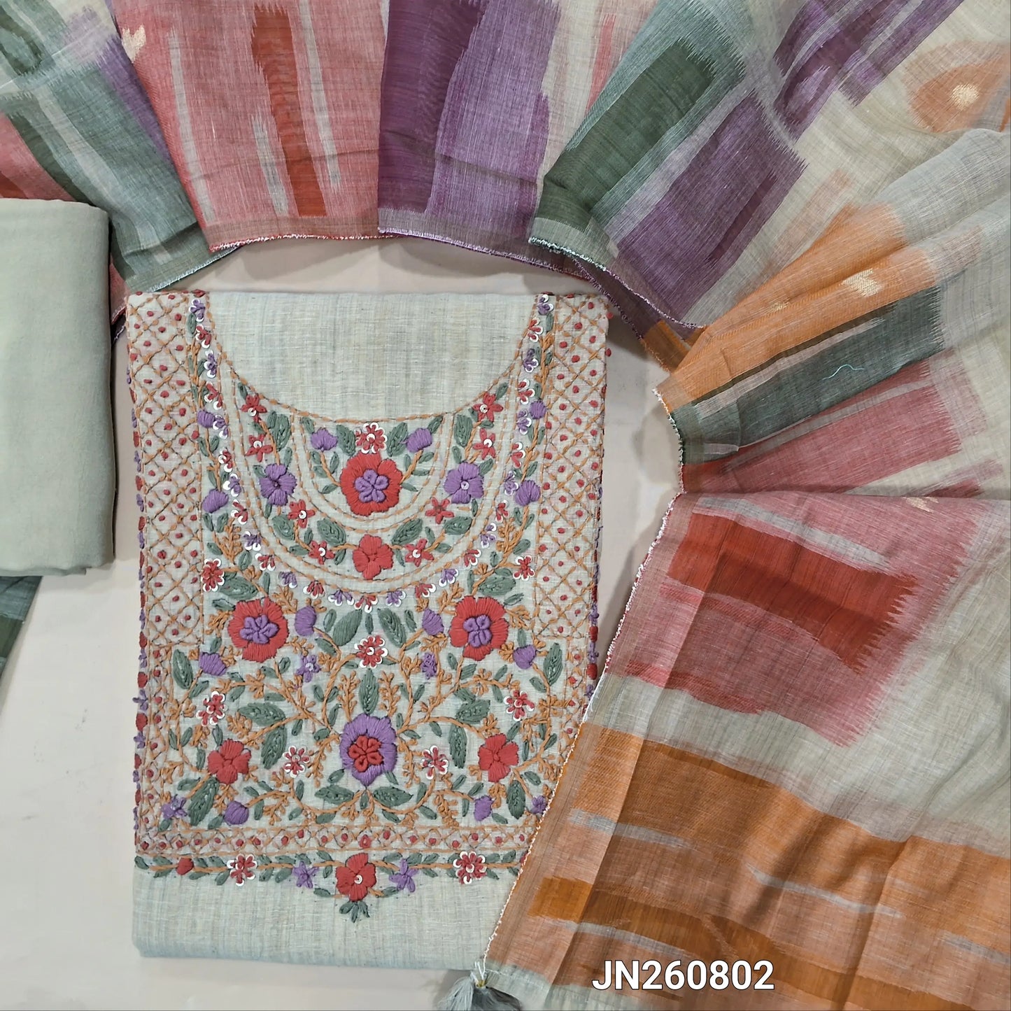 Rich beige slub silk cotton unstitched salwar material,hand embroidery and mirror work on yoke  ( textured,lining needed)spun cotton bottom,jamdani woven silk cotton dupatta(TAPPING NEEDED). JN260802