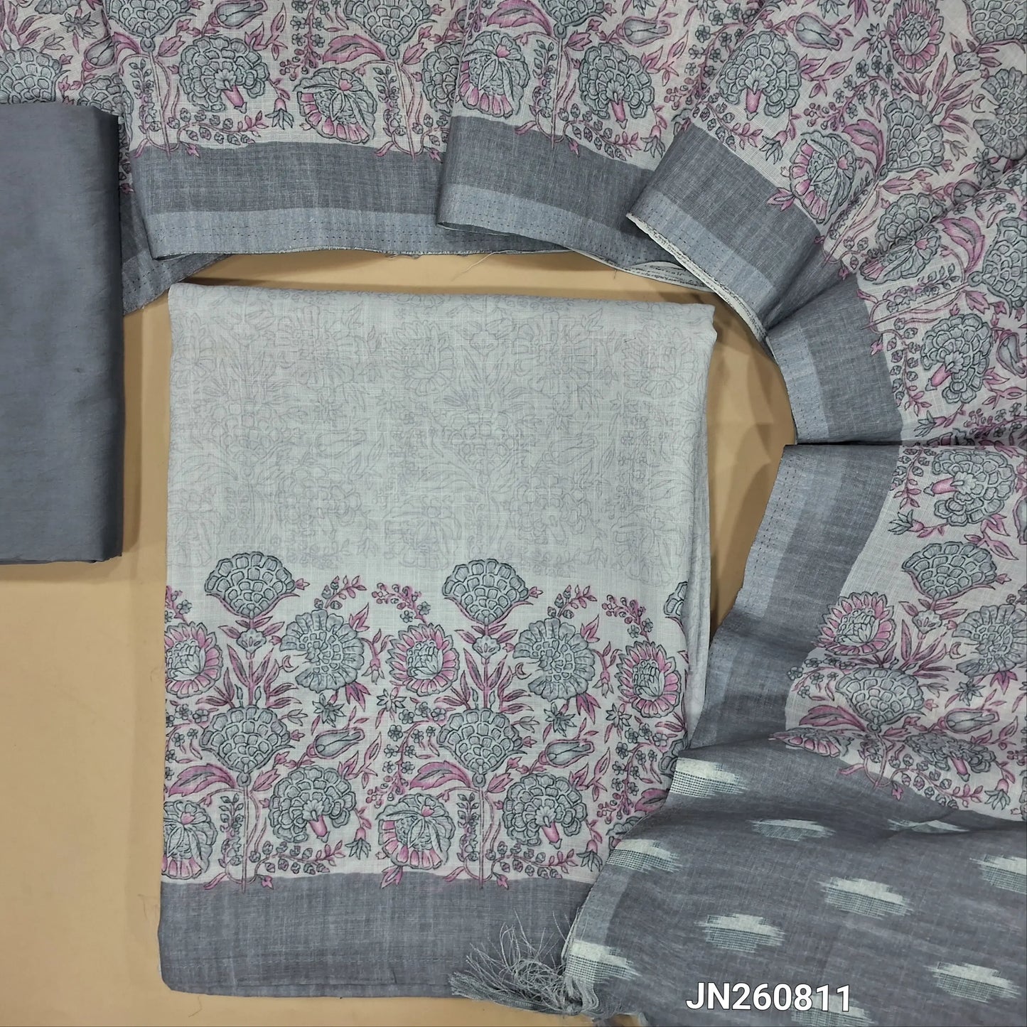 Light grey semi linen unstitched salwar material, printed daman border,(thin fabric, lining needed)dark grey silky bottom,printed full length semi linen dupatta with pallu. JN260811