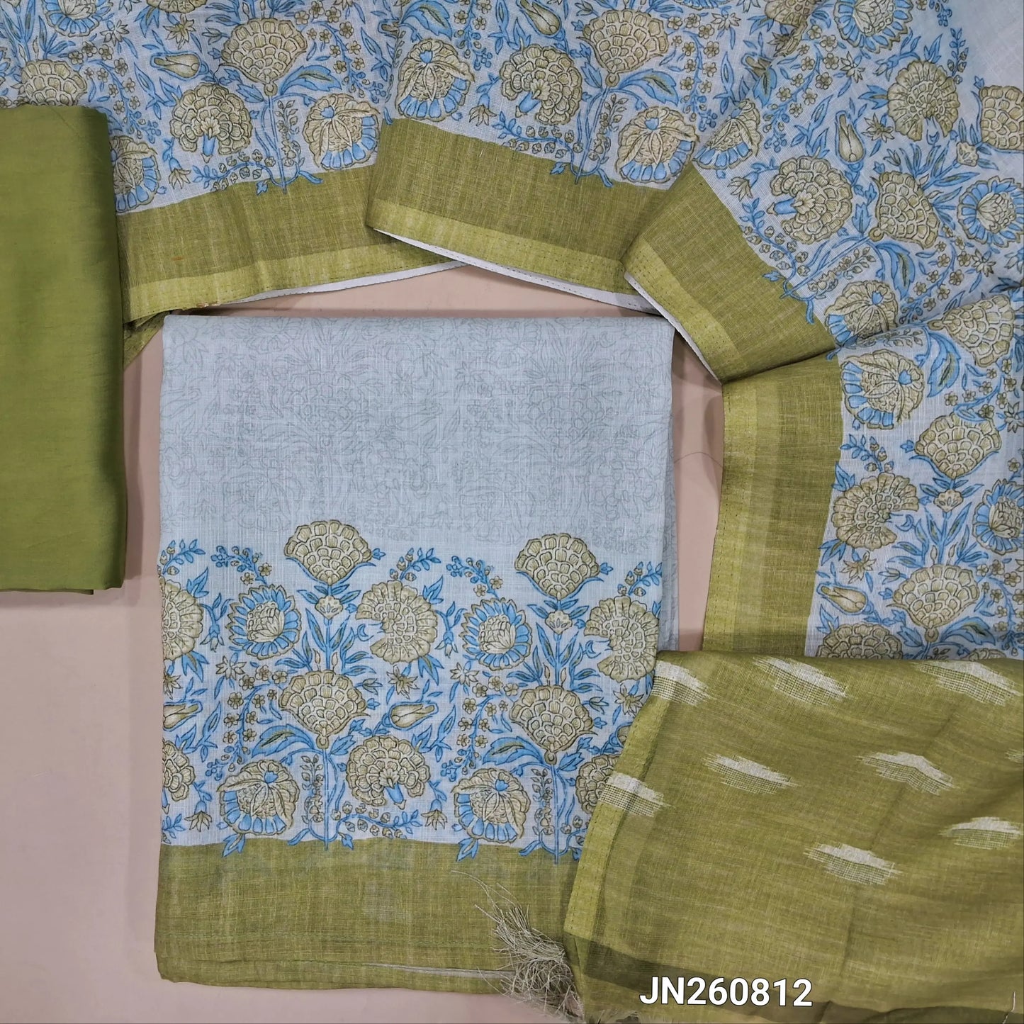 Light green semi linen unstitched salwar material, printed daman border,(thin fabric, lining needed)dark green silky bottom,printed full length semi linen dupatta with pallu. JN260812