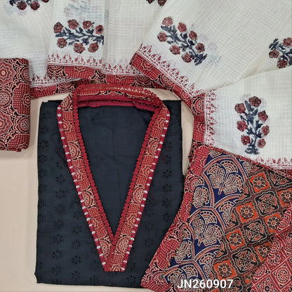 Black schiffli embroidery dobby cotton unstitched salwar material,collar neck with ajrak &real mirror work on yoke,(lining needed) reddish maroon printed cotton bottom, block printed kota dupatta with applique work on pallu. JN260907