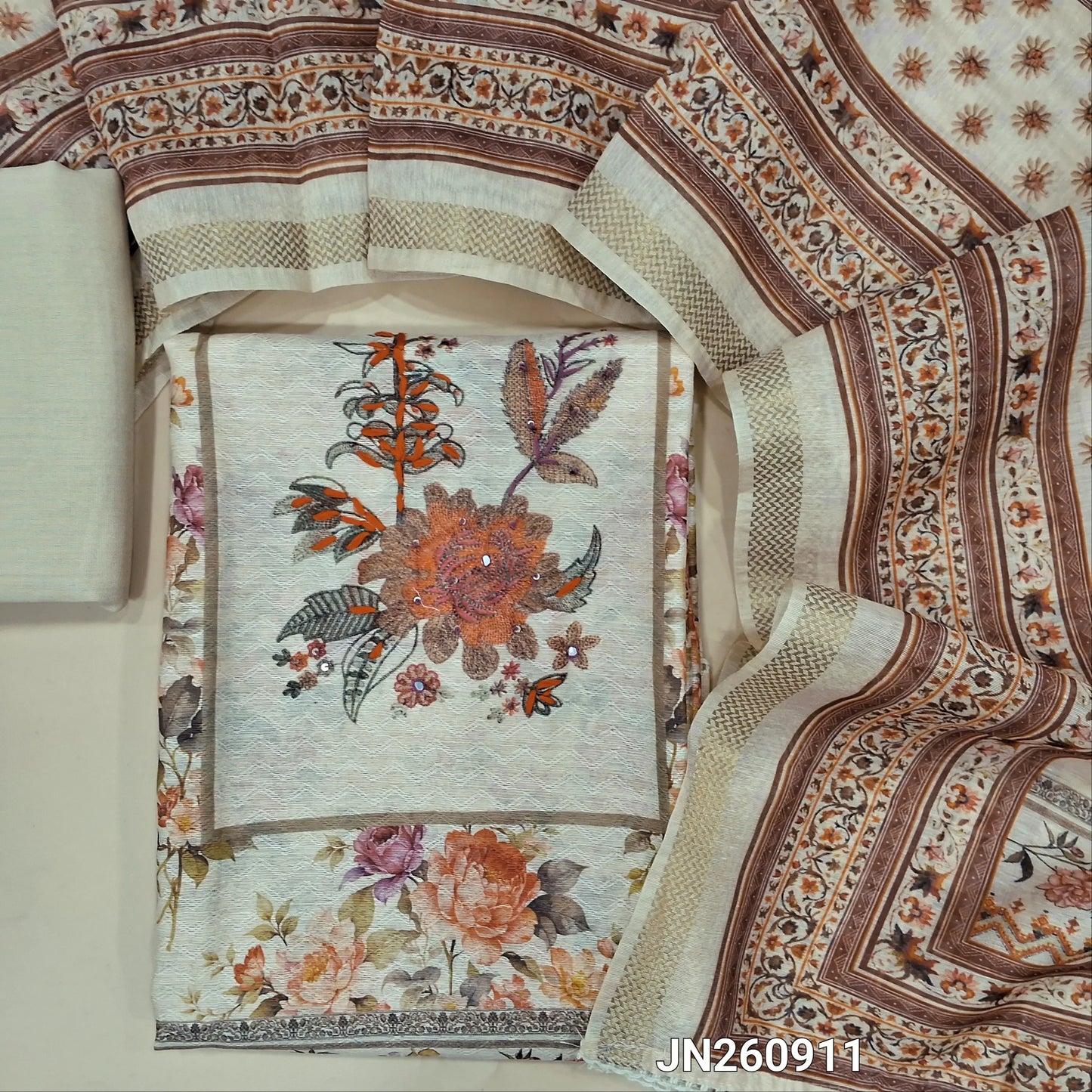 Rich beige jakard jute silk unstitched salwar material ( lining needed) faux mirror work on yoke,embroidery panel design, floral printed allover,matching spun cotton bottom, digital printed soft silk cotton dupatta with zari woven borders. JN260911