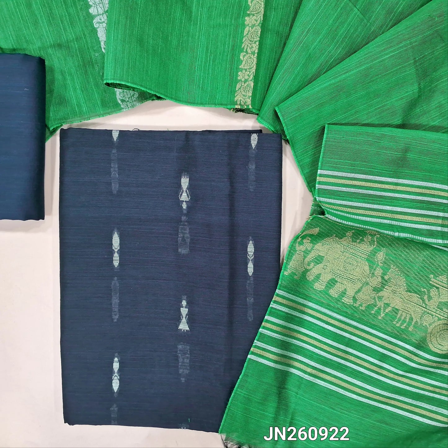 Dark blue slub silk cotton unstitched salwar material,warli weaving all over(lining needed)matching silk cotton bottom,silver and gold zari weaving on slub silk cotton dupatta with pallu.(TAPING NEEDED) JN260922