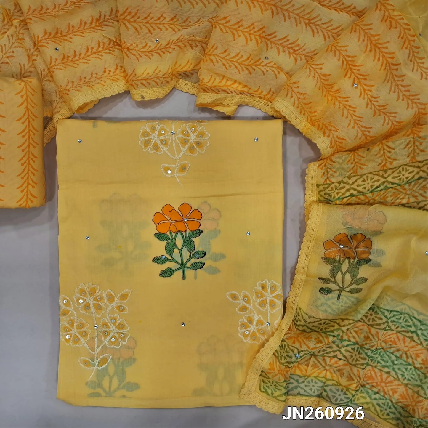 Designer yellow pure cotton unstitched salwar material,hand block prints, applique ,embroidery & sequins work on front (lining needed) block printed cotton bottom,block printed pure chifffon dupatta with lace tapping. JN260926