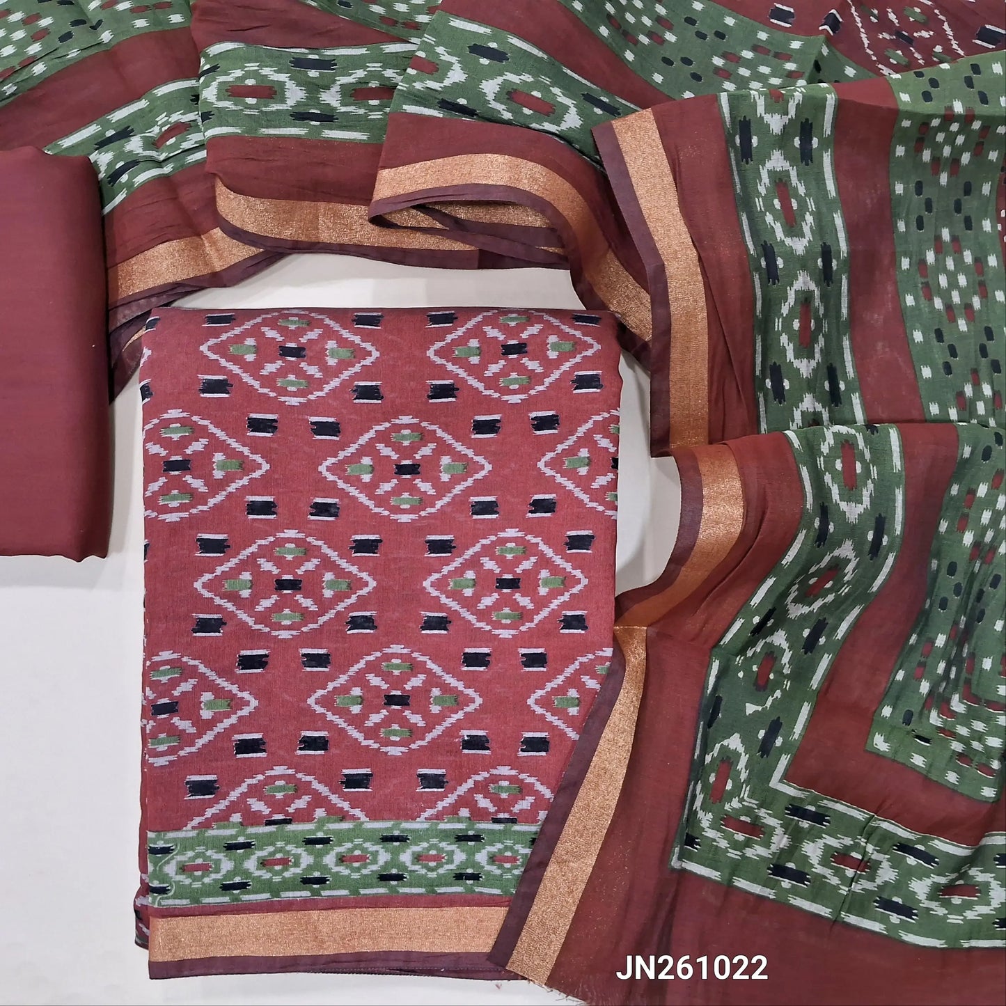 Dark maroon soft silk cotton unstitched salwar material,ikat printed all over ( Lining Needed) matching spun cotton bottom, ikat printed soft silk cotton full length dupatta (TAPINGS NEEDED). JN261022