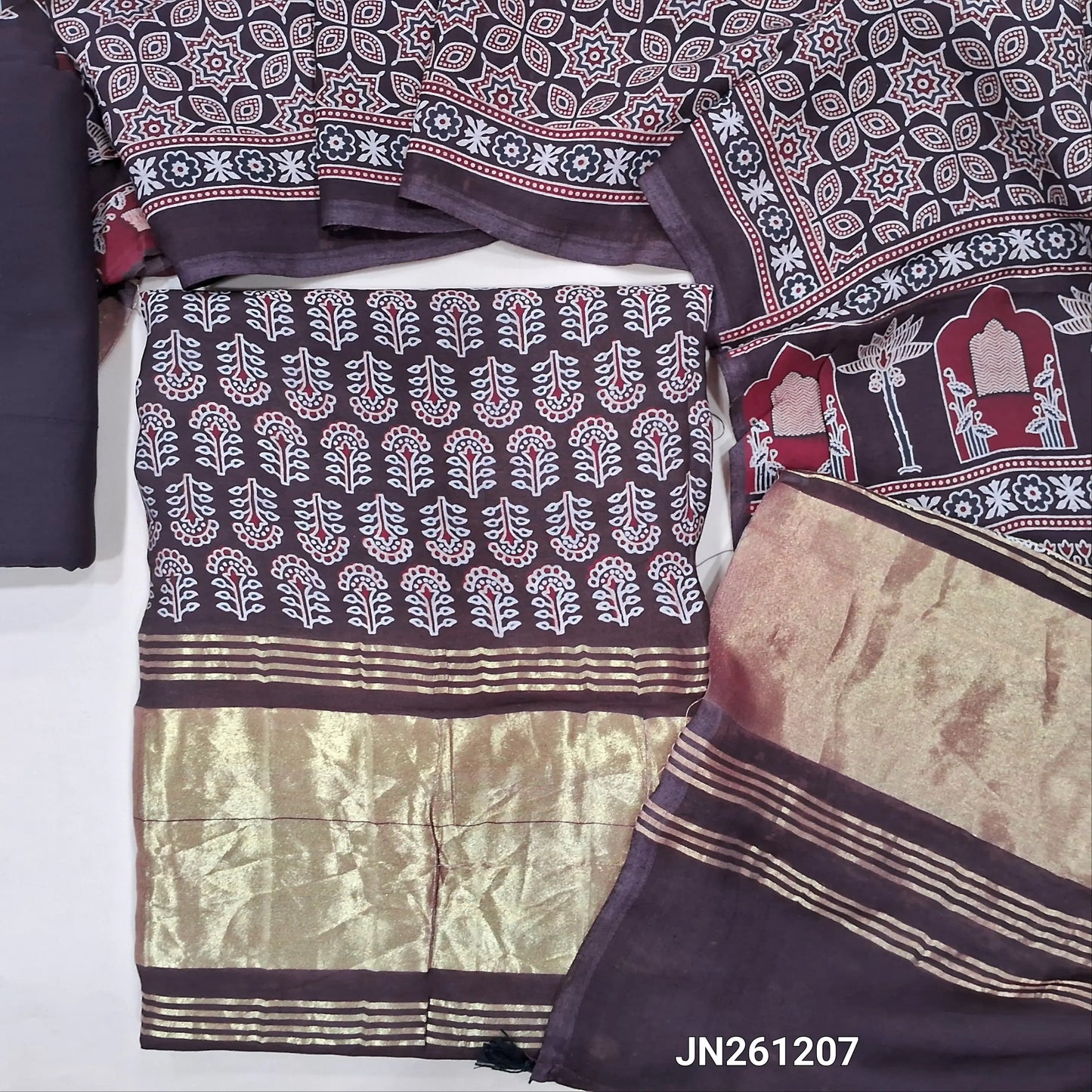 Dark brown ajrak printed taspa silk unstitched salwar material(lining needed) gold tissue borders on daman, hand block prints all over,matching cotton bottom,ajrak printed taspa silk dupatta with tissue pallu (TAPING NEEDED) JN261207