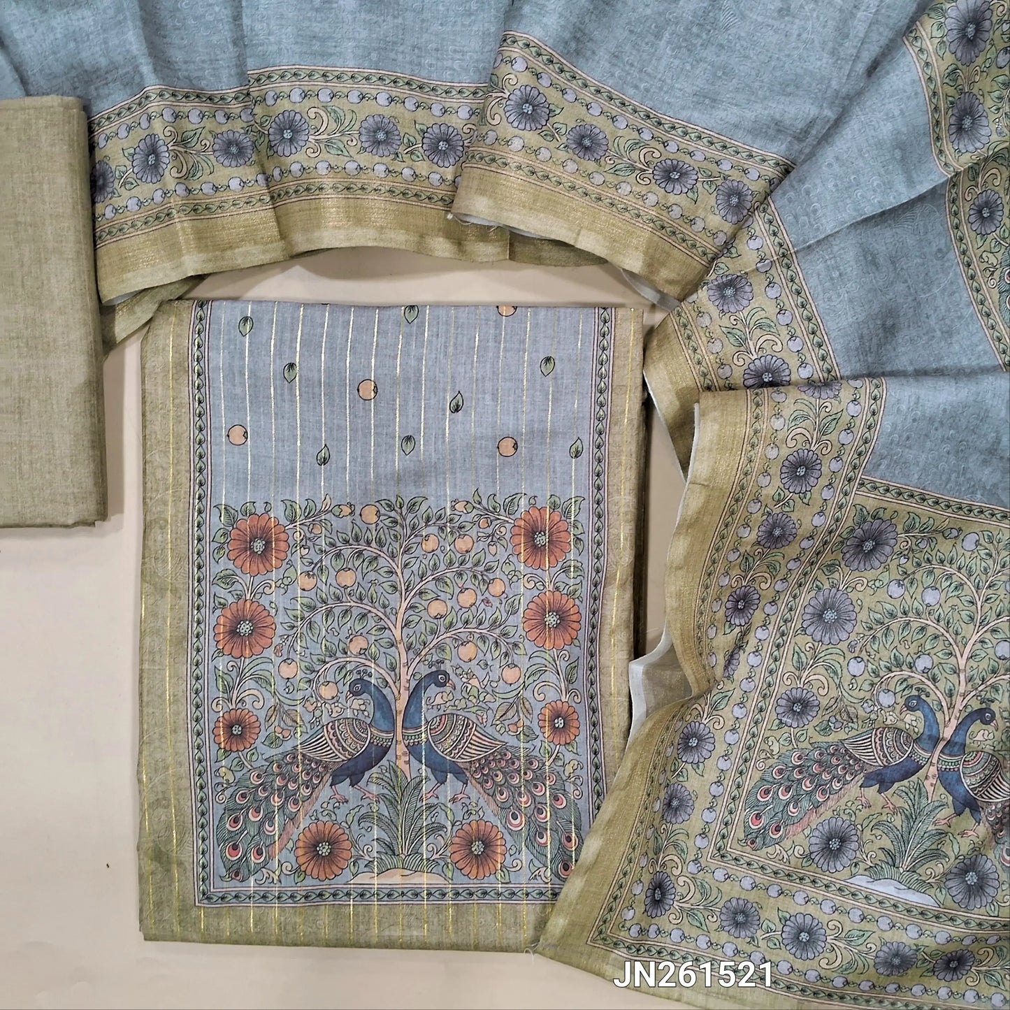Light olive green digital printed soft silk cotton unstitched salwar material(lining needed)peacock printed yoke,vertical gold zari lines all over,matching bottom,digital printed full length soft silk cotton dupatta.JN261521