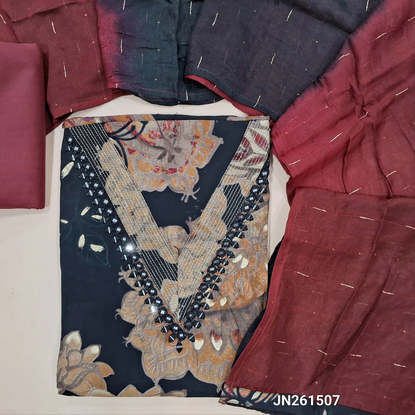 Black soft modal muslin silk unstitched salwar material(lining optional)real mirror work on yoke, digital printed all over,maroon cotton bottom, zari lines, sequins on dual shade  soft silk cotton dupatta.JN261507