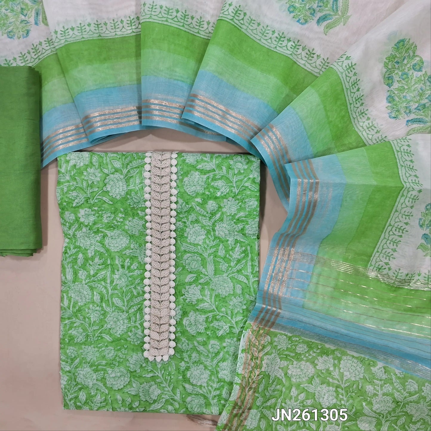 Green block printed chanderi silk cotton unstitched salwar material,thread work & fancy less work on yoke (light weight,Lining Needed) matching silky bottom, block printed chanderi silk cotton dupatta with zari detailing. JN261305