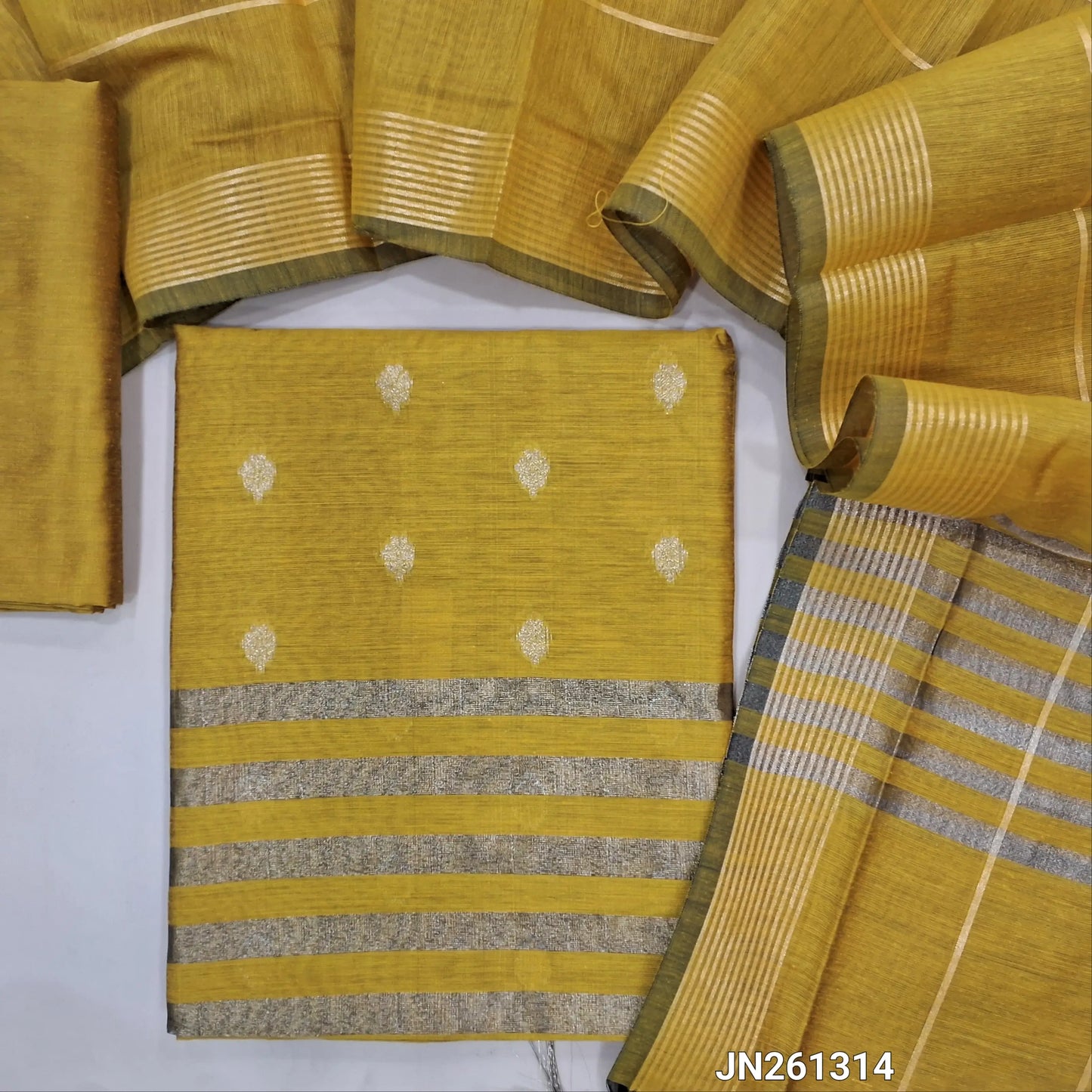Mehandhi yellow Benarasi soft silk cotton unstitched salwar material(lining needed) gold zari buttas allover, tissue line daman, matching silk cotton bottom, zari linen soft silk cotton dupatta with gold tissue pallu. JN261314