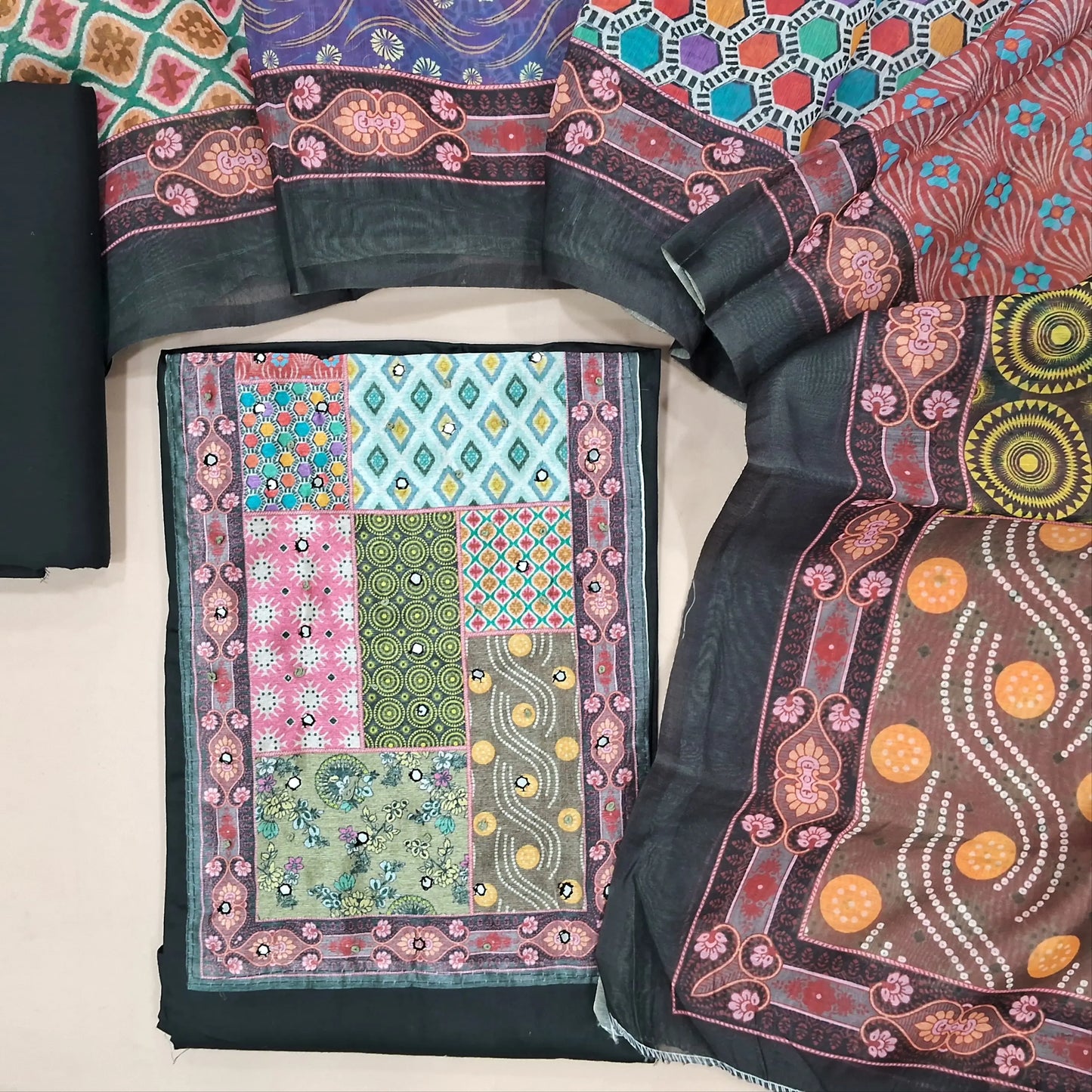 Black satin cotton unstitched salwar material(lining needed) digital print, faux mirror work on yoke, matching cotton bottom, digital printed fancy silk cotton dupatta. (TAPING NEEDED). JN261404