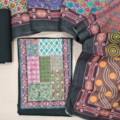 Black satin cotton unstitched salwar material(lining needed) digital print, faux mirror work on yoke, matching cotton bottom, digital printed fancy silk cotton dupatta. (TAPING NEEDED). JN261404
