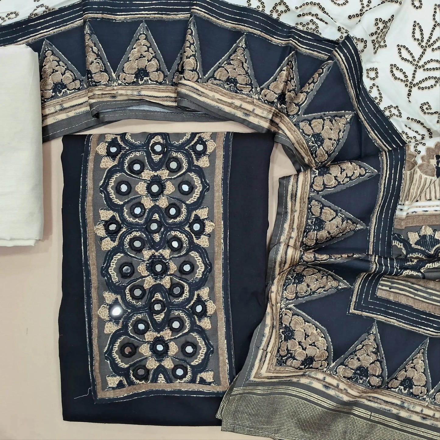Black rayon fabric unstitched salwar material, printed and real mirror on yoke,(lining needed)off white cotton bottom, bandhini printed short width modal cotton dupatta. JN261408