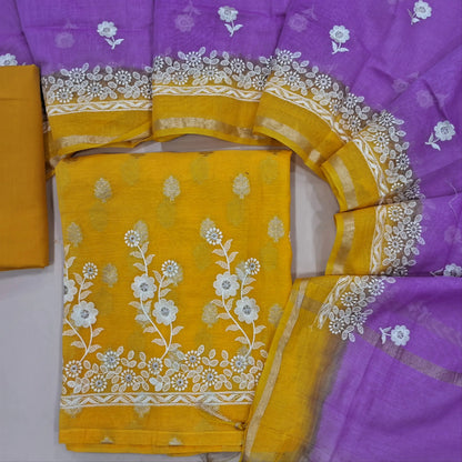 Designer yellow mul chanderi unstitched salwar material (soft,Lining Needed) antique gold zari buttas all over, embroidery work on daman, matching cotton bottom, embroidery work on mul chanderi dual shaded dupatta with gold tissue borders. JN261403