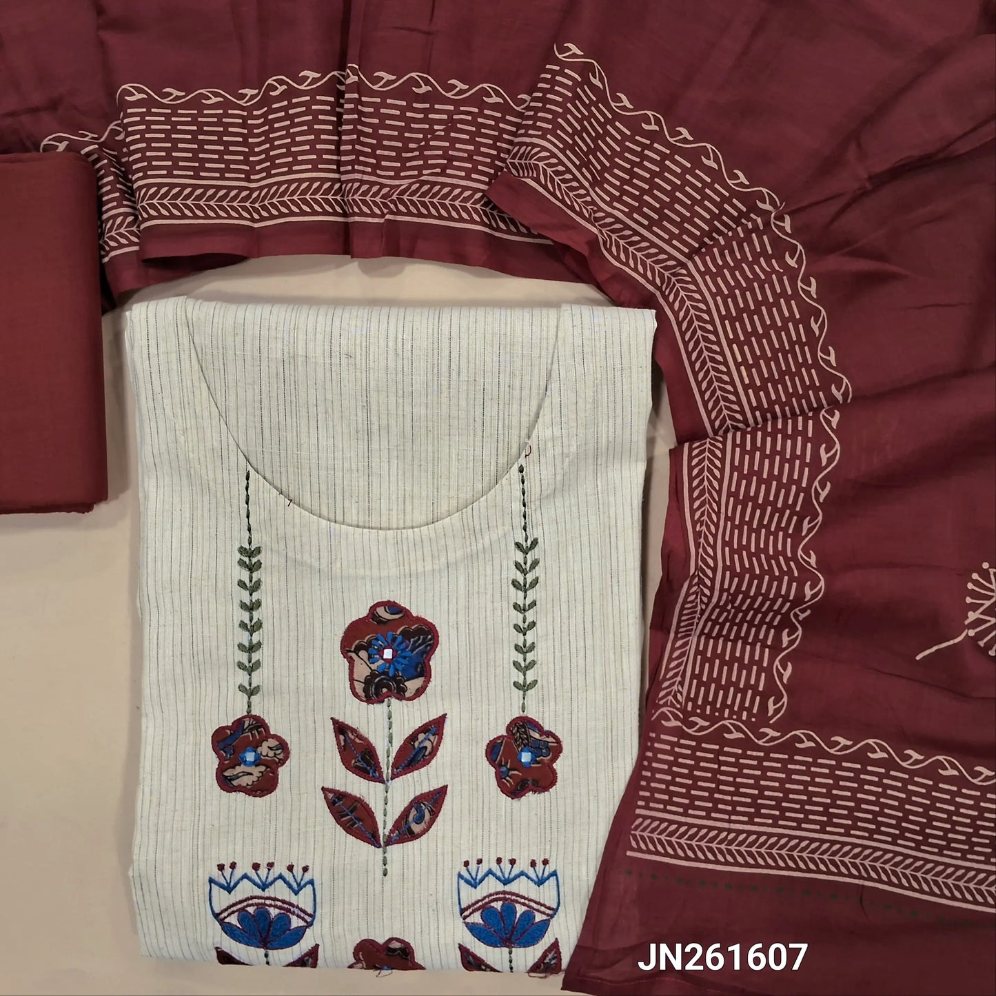 Light beige premium slub cotton unstitched salwar material,applique work and thread embroidery on yoke, self woven design all over,( soft,lining needed)maroon cotton bottom, block printed mul cotton dupatta(TAPPING NEEDED). JN261607
