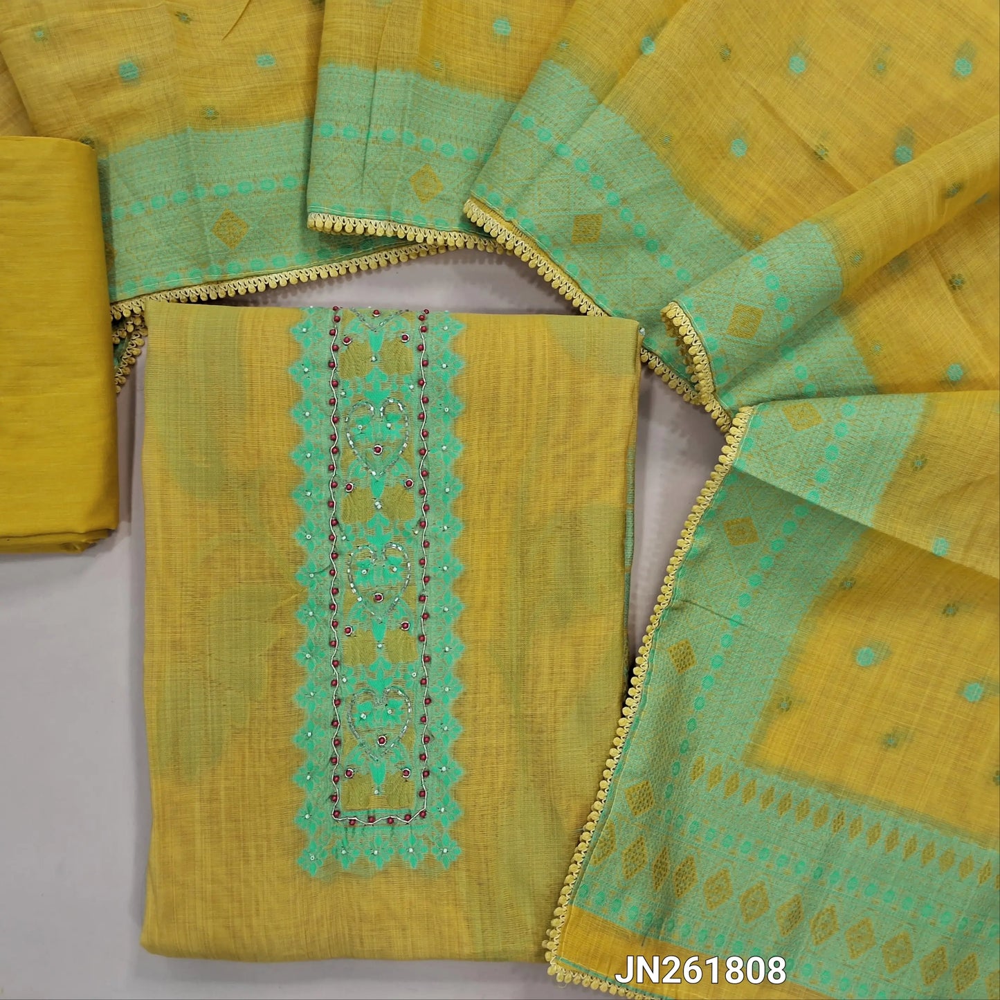 Mehandhi yellow premium jamdhani woven silk cotton unstitched salwar material, thread woven, bead and zardosi work on yoke &daman ( Lining Needed) matching cotton bottom,jamdhani woven on floral buttas silk cotton dupatta with less tapping. JN261808