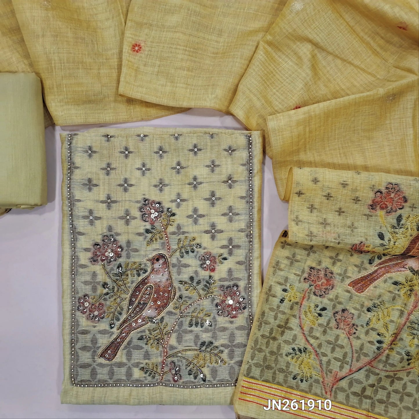 Designer pastel yellow jamdhani woven silk cotton unstitched salwar material,sugar bead,cut bead and sequins work on yoke, zari buttas on front ( Lining Needed) matching cotton bottom,jamdhani woven on silk cotton dupatta with less tapping. JN261910