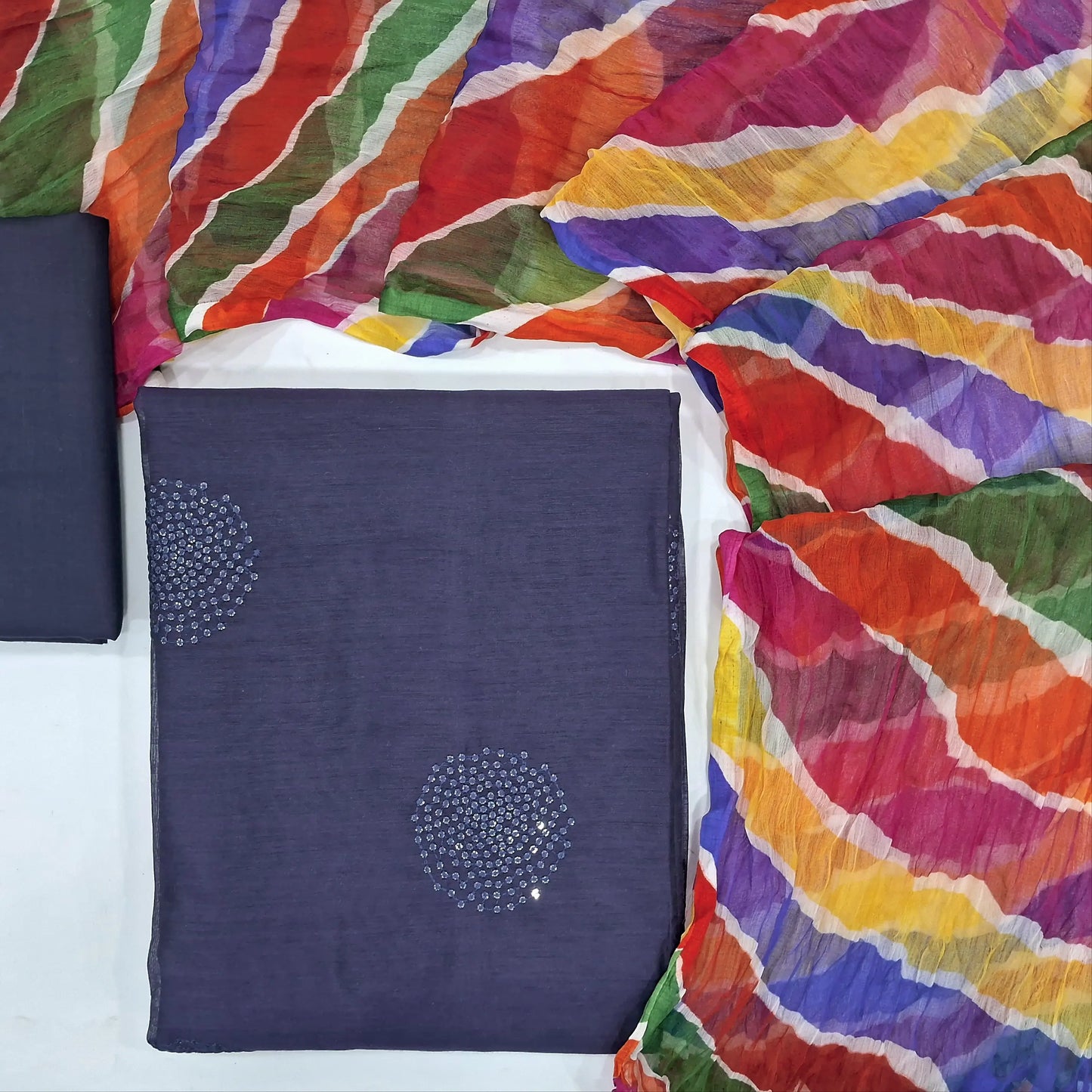 Dark blue fancy silk cotton unstitched salwar material,(lining needed) sequins work on front, matching cotton bottom, multicolor fancy chiffon dupatta. JN262107