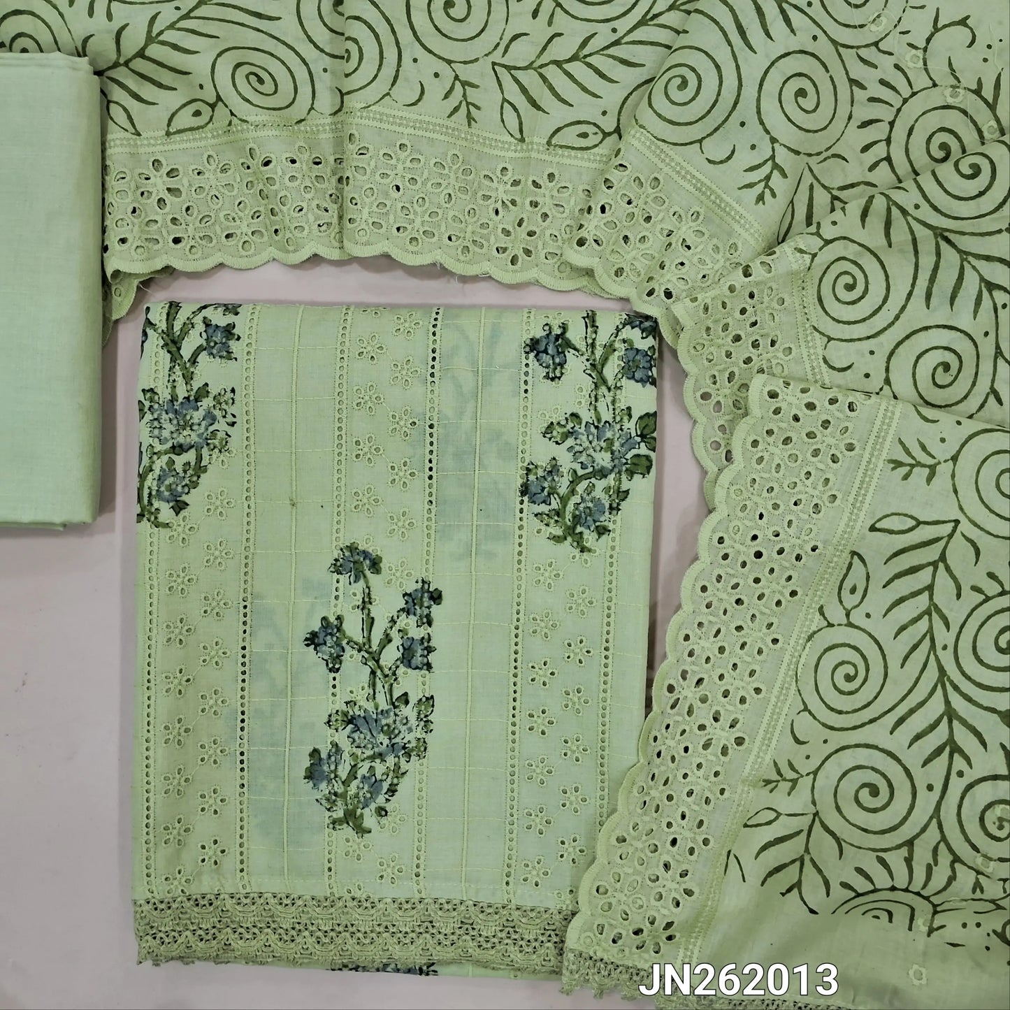 Pastel green block printed soft glazed cotton unstitched salwar material(lining needed) schiffli embroidered,cut work & self embroidery work on front, cotton bottom,block printed & schiffli embroidered mul cotton dupatta with scallop borders. JN262013