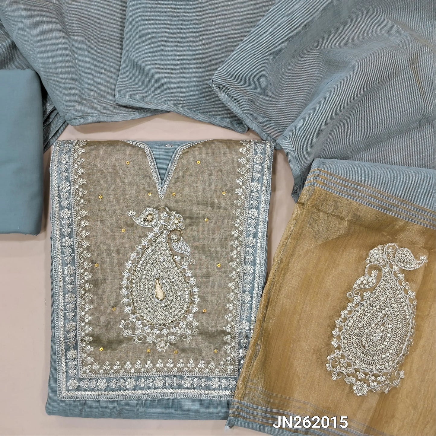 Grey silk cotton unstitched salwar material,zari buttas all over,gold tissue yoke with zarodzi,sequins and cut bead(lining needed)matching cotton bottom,silk cotton dupatta with gold tissue zari work pallu. JN262015