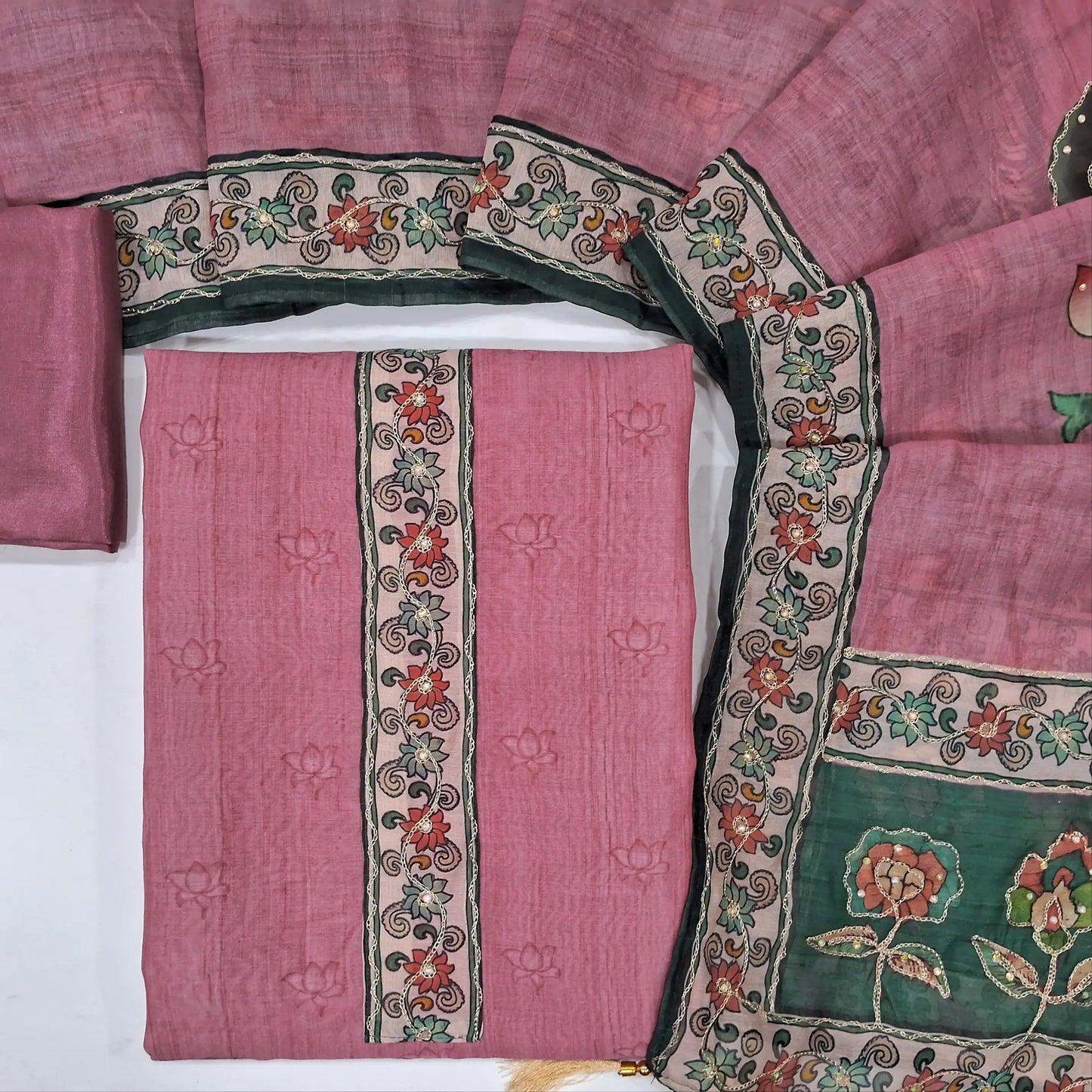 Pink digital printed soft silk cotton unstitched salwar material (lining needed) zari & sequins work on yoke,printed all over, matching silky bottom, digital printed zari on silk cotton dupatta. JN262103