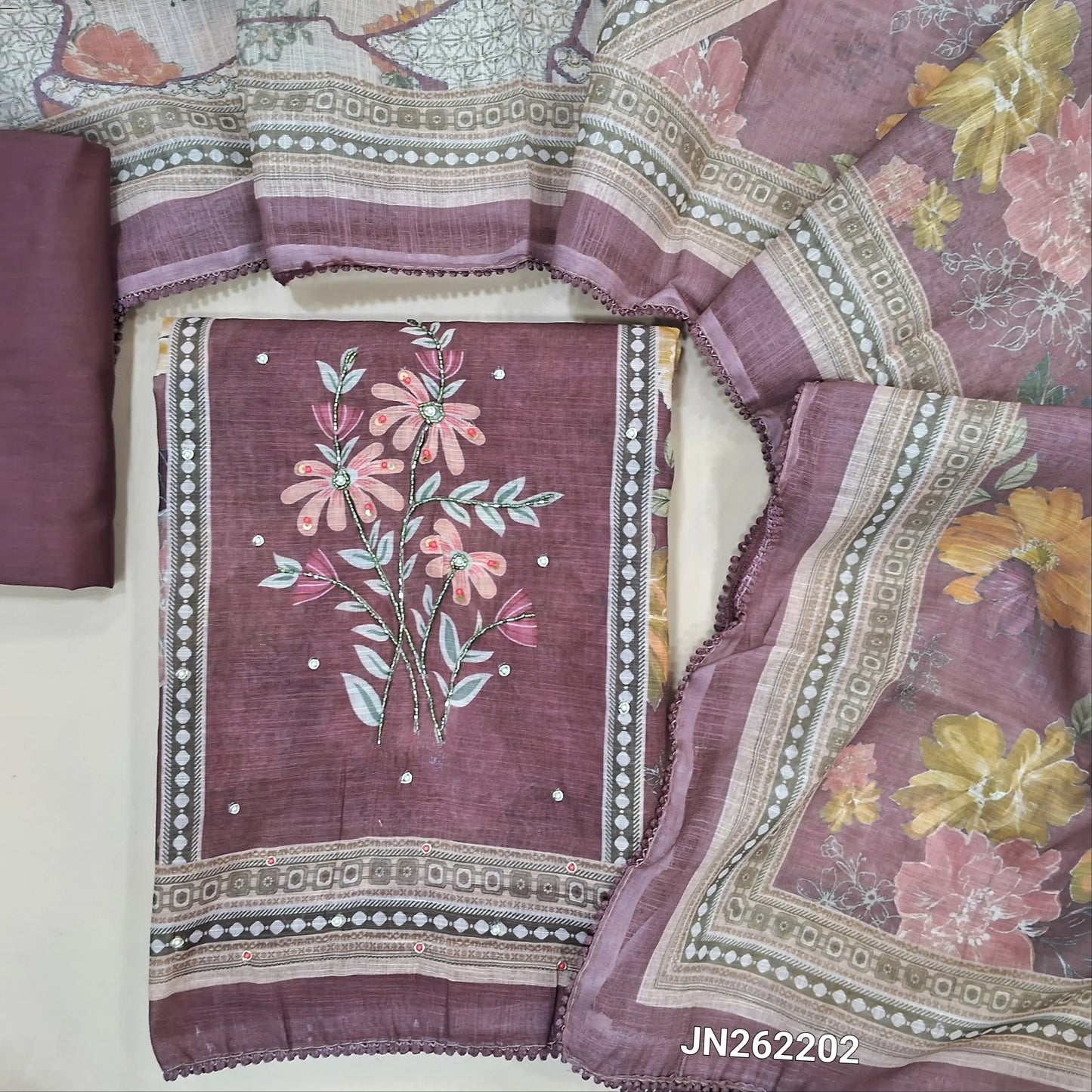 Dark mauve floral printed semi linen unstitched salwar material(lining needed)penal design,cut bead & zardosi work,matching cotton bottom,floral printed semi linen full length dupatta. JN262202