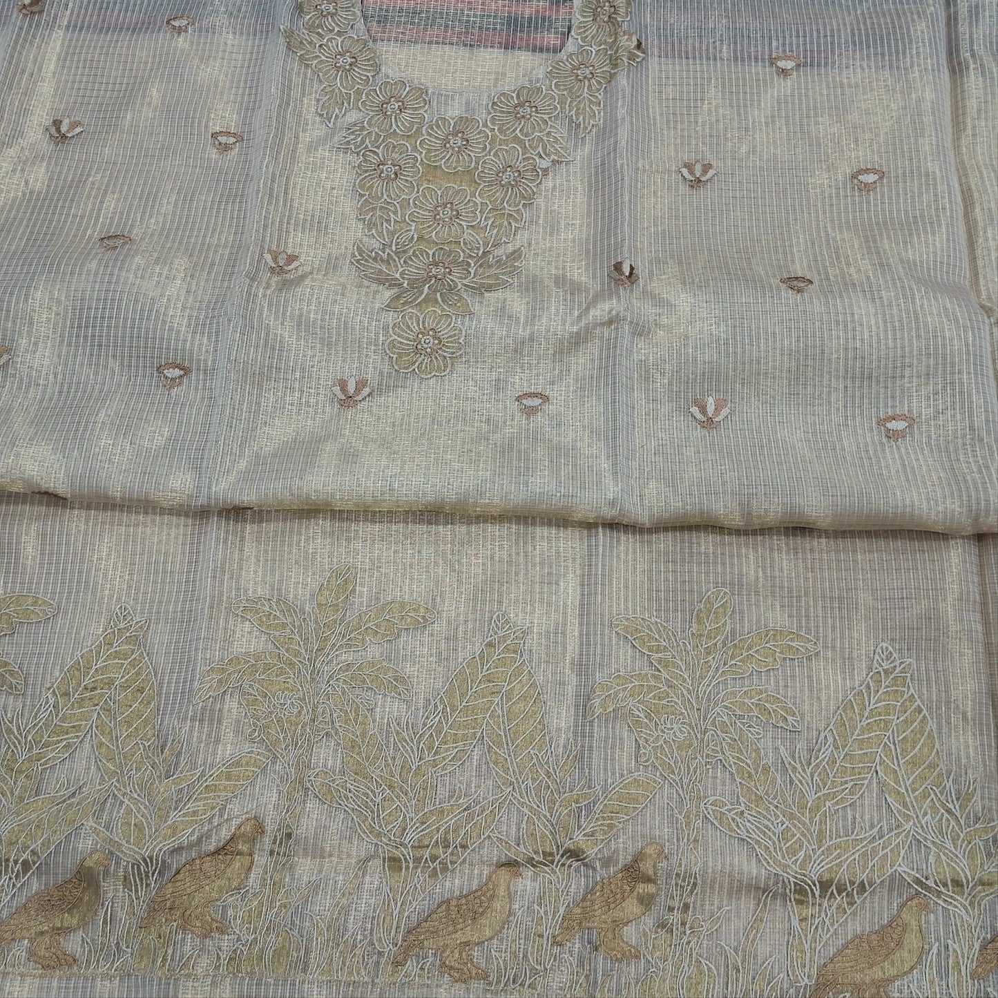Rich golden beige premium tissue kota unstitched salwar material (lining needed) rich embroidery work on yoke,embroidery & applique work on daman,spun cotton bottom, rich embroidery work on tissue kota dupatta with benarasi zari woven borders. JN262201
