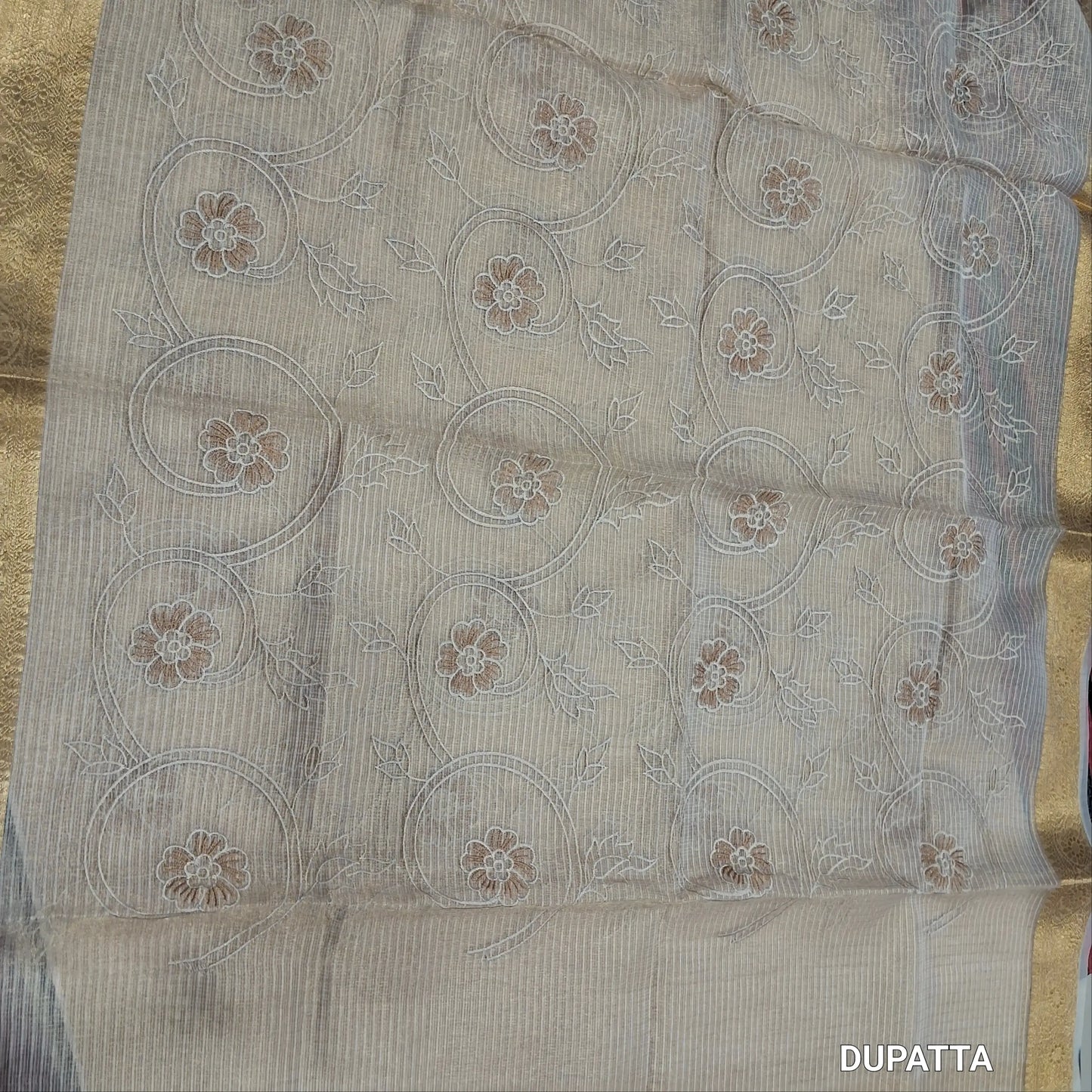 Rich golden beige premium tissue kota unstitched salwar material (lining needed) rich embroidery work on yoke,embroidery & applique work on daman,spun cotton bottom, rich embroidery work on tissue kota dupatta with benarasi zari woven borders. JN262201