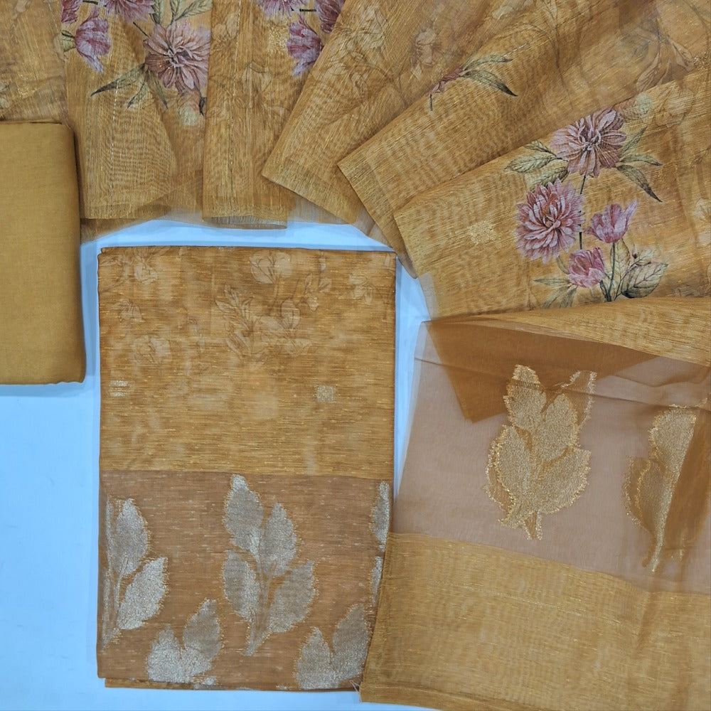 Dark fenugreek yellow designer printed slub silk cotton unstitched salwar material, zari buttas on front(thin fabric, lining needed)rich daman, matching santoon bottom, floral printed slub silk cotton dupatta with rich pallu. CODE SP240416