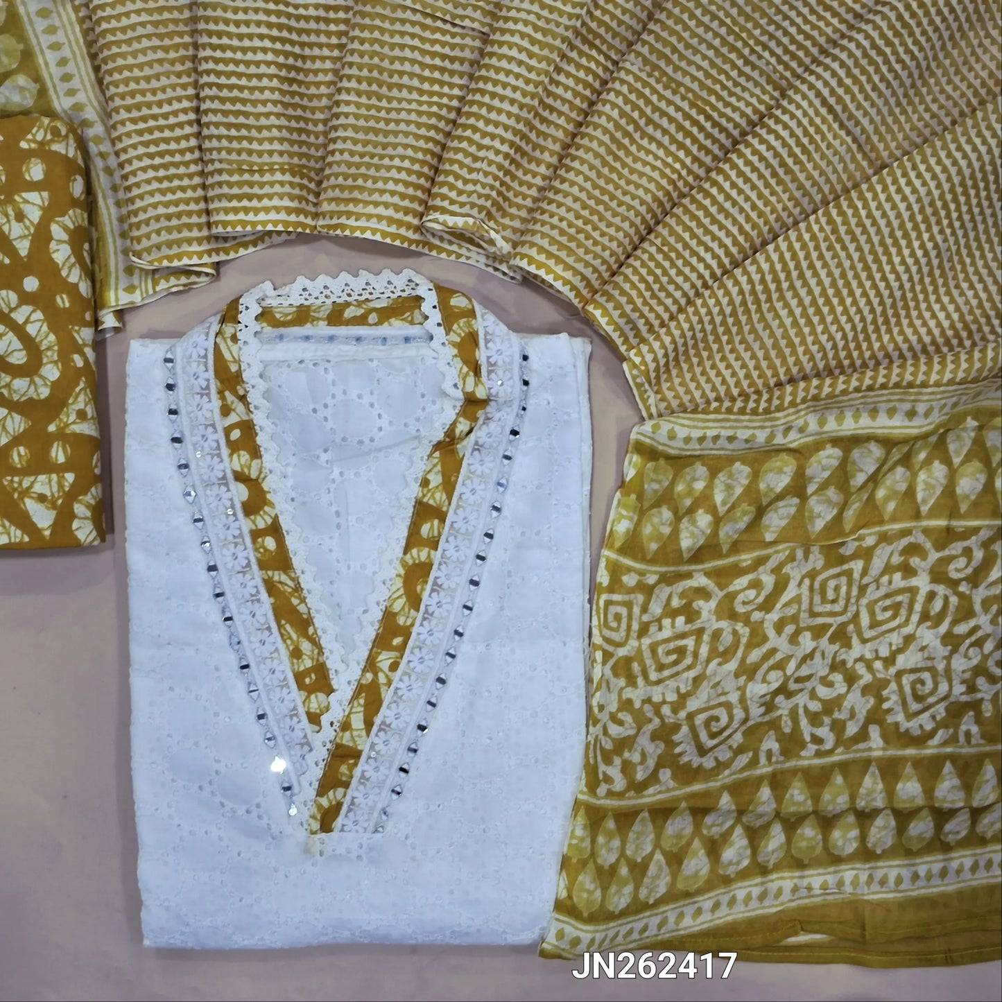 White schiffli embroidered pure cotton unstitched salwar material(lining needed) real mirror work on yoke, schiffli work all over, mehandhi yellow batik dyed cotton bottom, printed soft mul cotton dupatta. JN262417