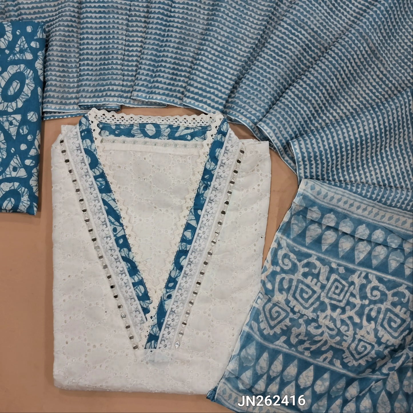 White schiffli embroidered pure cotton unstitched salwar material(lining needed) real mirror work on yoke, schiffli work all over, dark blue batik dyed cotton bottom, printed soft mul cotton dupatta. JN262416