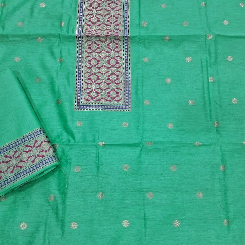 Light turquiose green premium jamdani woven silk cotton unstitched salwar material (soft,lining needed)benarasi weaving work on yoke,floral buttas on front,silk cotton bottom,zari & thread woven  premium organza dupatta with rich pallu. JN262512