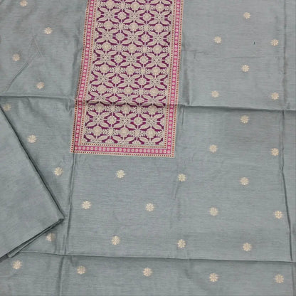 Sliver grey premium jamdani woven silk cotton unstitched salwar material (soft,lining needed)benarasi weaving work on yoke,floral buttas on front,silk cotton bottom,zari & thread woven premium organza dupatta with rich pallu. JN262510
