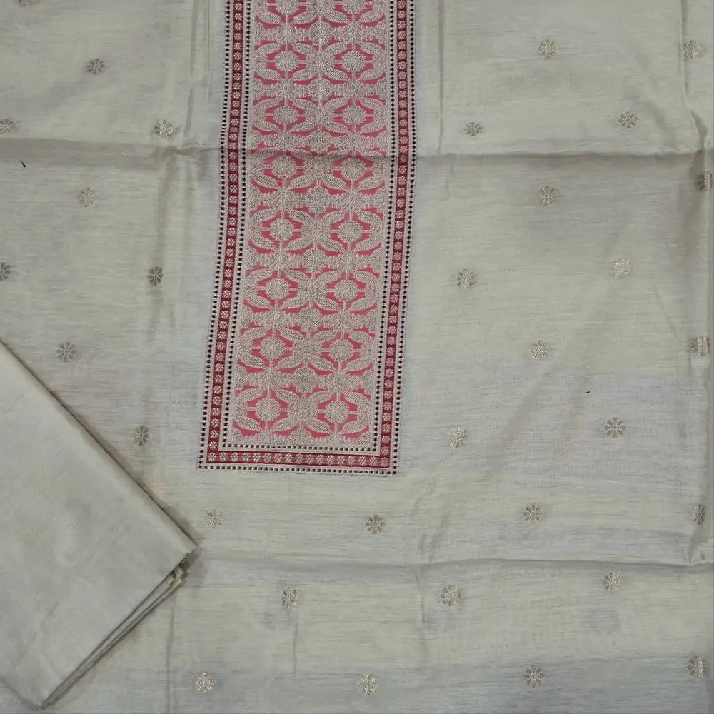 Off white premium jamdani woven silk cotton unstitched salwar material (soft,lining needed)benarasi weaving work on yoke,floral buttas on front,silk cotton bottom,zari & thread woven  premium organza dupatta with rich pallu. JN262511