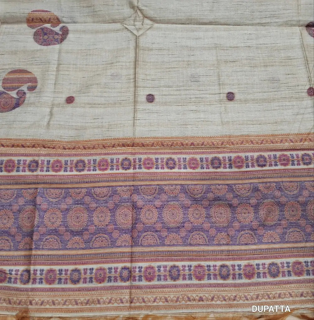 Designer beige premium tussar silk unstitched salwar material,(lining needed)weaving work on yoke,jamdani woven buttas on front & daman, silk cotton bottom, thread jamdani woven on full length tussar silk dupatta with tassels.JN262606