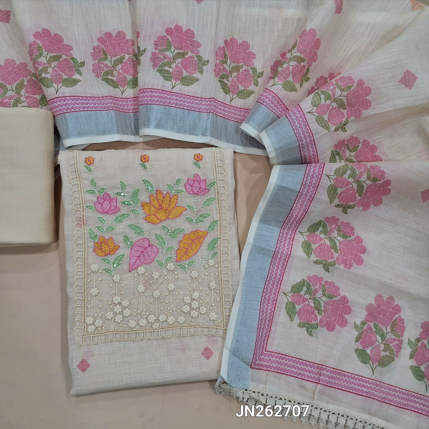 Off white premium linen unstitched salwar material,thread embroidery work on yoke, floral printed on daman(lining needed) matching spun cotton bottom,floral printed premium semi linen dupatta with silver tissue borders. JN262707
